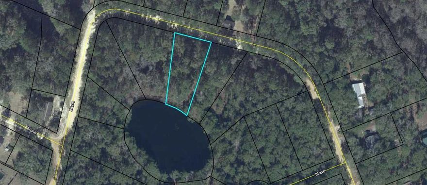 68 feet LAKEFRONT LOT, in Ponce de Leon city limits near Hwy 81. This wooded lot is located on a one acre lake in Blue Creek Estates S/D. Great home site. Restrictions include homes not less than 800 SF. No mobile homes allowed. City water and sewer are available. Water tap, $1,000, Sewer tap, $1,500. No homes on lake presently so take your pick with multiple lots available. Ask for price list. Great price for home site in town!