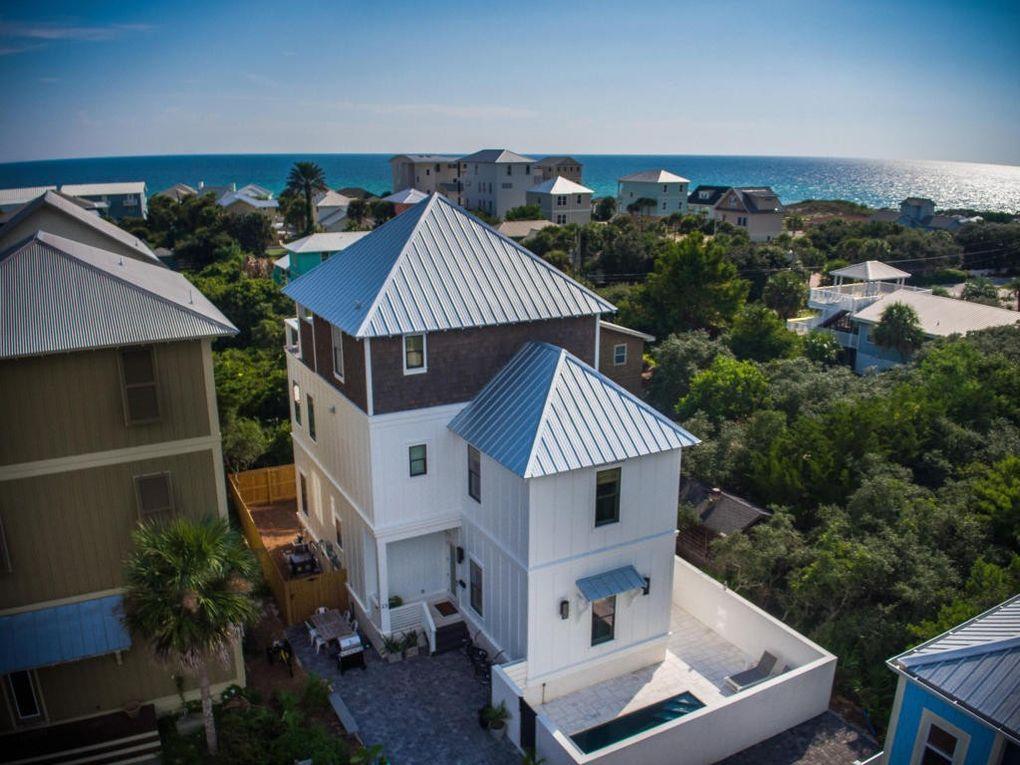 23 Bluewater View Ave, in popular Inlet Beach, is the perfect, luxury beach home offering fabulous gulf views from its second and third floors. It's uniquely located a few blocks from the beach and just east of iconic Hwy 30A. There are two master suites with king beds (first and second floors), a king bedroom (first floor), and two bunk rooms with four twin sized beds in each room (first and third floors). The bunk rooms each have adjoining bathrooms. Relax and watch the kids swim at the home's private salt water pool. Let the elevator do the work for you with a ride to each floor. Enjoy the third floor's oversized deck and summer kitchen- a cozy spot that's perfect for sunsets and sunrises alike.