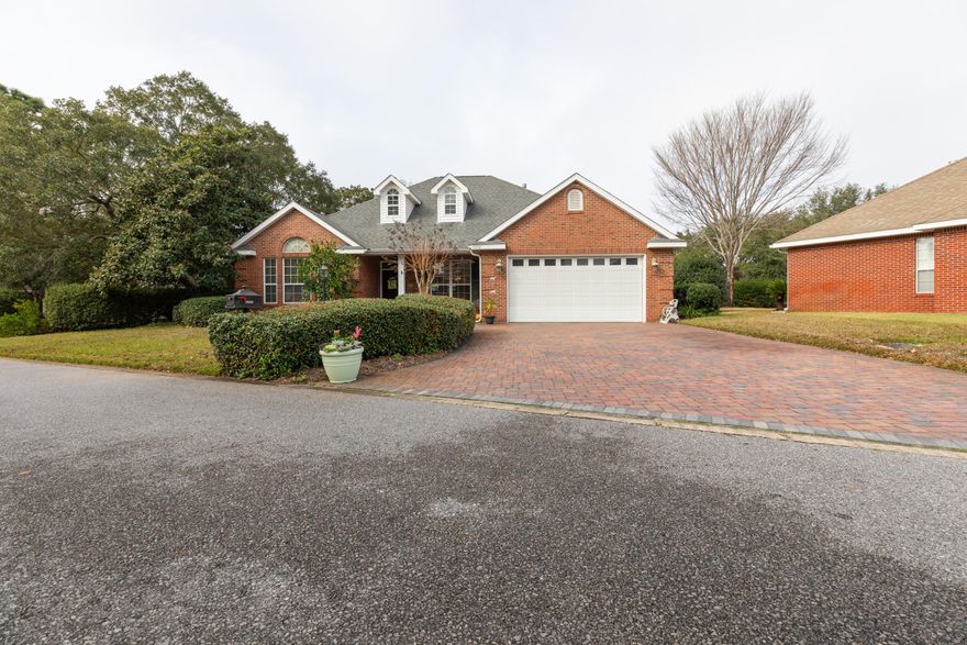Stunning executive home in the gated neighborhood of Magnolia Plantation. This home was a Parade of Homes award winner when it was built. It boast 10 foot ceilings, a large chef's kitchen with a gas range and a center island. This split floor plan offers privacy with a large master suite on one side of the house and the two guest bedrooms on the other. Enjoy morning coffee or afternoon tea on the screened in lanai. This home is located in an A+ school district and close to the beaches, shopping and restaurants. A new HVAC system was installed in 2016, there is only one bedroom with carpet the rest of the house is tile and the garage and laundry room lighting has been updated to LED.