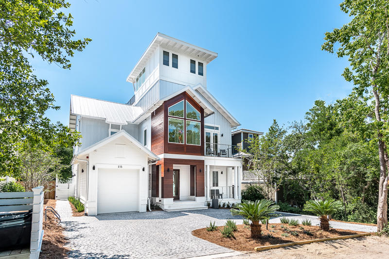 Coastal & Contemporary, Sexy & Sleek. Modern with mid-century accents, nestled among the live oak hammock of idyllic Old Seagrove. Edgy, refined & playful defines this over the top custom build. Unique, retro, and eye-catching features are throughout. Upon entering is the blonde cypress stairway lined with contemporary cable railing, and accented with modern lighting. At the top of the stairs is the vast open dining and living area accented with a painted brick wall, and bold, beautiful cypress beams. The kitchen incorporates professional Thermador appliances for the discerning chef and a variety of areas are available to dine - start with the 18 ft retractable door seamlessly opening the living area to a comfortable & screened porch overlooking the outdoor pool. Then take the elevator