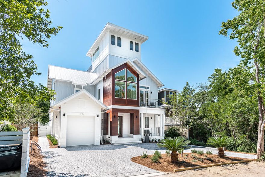Coastal & Contemporary, Sexy & Sleek. Modern with mid-century accents, nestled among the live oak hammock of idyllic Old Seagrove. Edgy, refined & playful defines this over the top custom build. Unique, retro, and eye-catching features are throughout. Upon entering is the blonde cypress stairway lined with contemporary cable railing, and accented with modern lighting. At the top of the stairs is the vast open dining and living area accented with a painted brick wall, and bold, beautiful cypress beams. The kitchen incorporates professional Thermador appliances for the discerning chef and a variety of areas are available to dine - start with the 18 ft retractable door seamlessly opening the living area to a comfortable & screened porch overlooking the outdoor pool. Then take the elevator