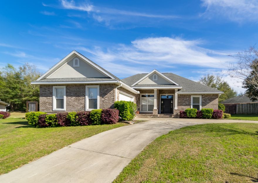 EXCEPTIONAL ONE-Of-A-KIND HOME. FEATURES 3 BEDS 2 BATHS, AND A BONUS ROOM; CUSTOM-BUILT AND INCLUDES EVERY EXPENSIVE UPGRADE THAT YOU CAN IMAGINE. The living room features large windows, tons of natural light, raised and coffered ceilings, and beautiful Maple hardwood floors that flow throughout the home. The kitchen overlooks the living room, perfect for entertaining. Features: stainless steel appliances and back splash, Silestone counter tops, a large island and breakfast bar, a coffee bar, dark wood cabinets, soft close drawers, and gas range. Follow the Maple hardwood floors to the south side of this split bedroom home to the stunning master bedroom and en-suite bathroom. The master bedroom highlights a stylish solid brick accent wall which provides a very warm feel.