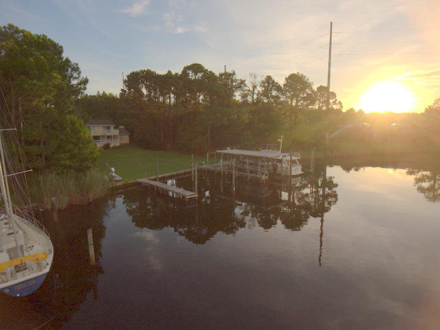 Sailboats and large vessels are welcome in this ''deep water'' retreat! Located in Rocky Bayou just prior to the bridge, this property allows for several larger vessels. The private dock will accommodate 5 boats and one slip has a covered lift, allowing for slip rental income. With over 3/4 acre and 130 feet of waterfront, check out this rare find. You will find a very well cared for and updated 4 bedroom, 3.5 bath home. Most of the rooms have a walk-out deck on the back of the home for a beautiful view on all levels. There is a newer HVAC system, newer dimensional shingled roof, wood flooring, Shaker cabinets with soft close drawers, tile backs plash, granite counter tops, gas fireplace, central vac., sprinkler system, and a termite bond in place.