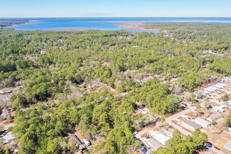 Builders, investors or those looking for their own piece of the beach may find it in this vacant land opportunity in the Town of Santa Rosa neighborhood, with no HOA and nearby proximity to Cessna Landing boat launch on Choctawhatchee Bay and the beaches of Scenic Highway 30A. Lots 4 & 5 can be purchased together at $110,000, lot 3 at $55,000 or at a premium price of $160,000 for all three. Build to suit on these secluded parcels near plenty of opportunities for watersports as well as convenient options for shopping and dining. City water and sewer is available as well as a recent survey for all three lots, which have been divided. Lots 4 & 5 measure 100x125, lot 3 at 50 x 125 or all 3 at 150x125.  Buyer to verify all information if important. Call today for details.
