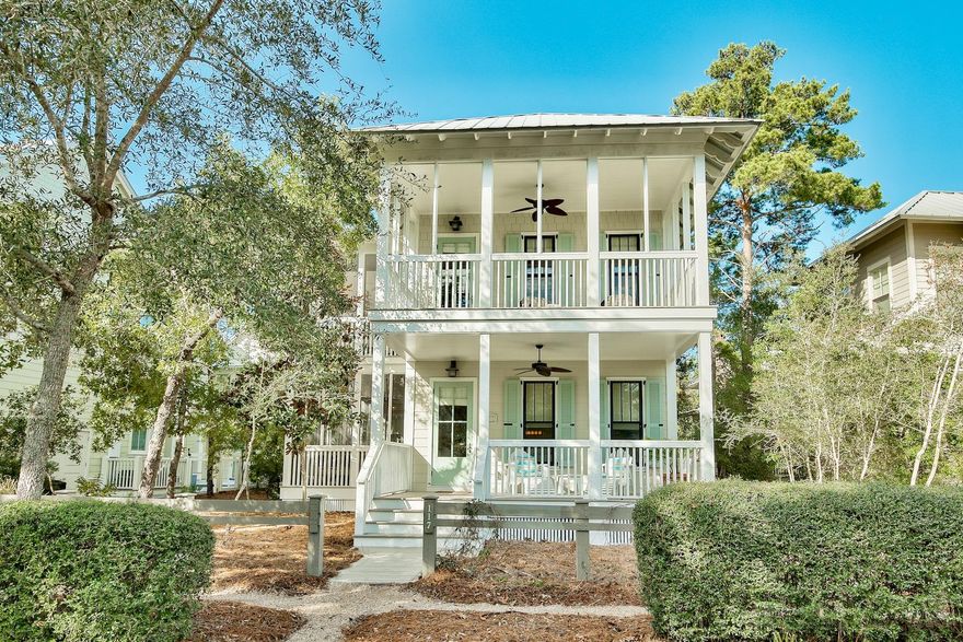 Enviably located between Grayton Beach and Seaside, this laid-back WaterColor home is in a secluded position close to the community pool and Camp WaterColor. It was designed for experiencing the outdoor Florida lifestyle with screened and open porches on both levels. Spacious rooms are freshly painted and enhanced by gleaming hardwood flooring and ''beachy'' timber-clad walls. Granite counters and high-end cabinets grace the chef's kitchen which centers on an island breakfast bar. The first floor bedroom allows you to live on one level, if you wish. Four bedrooms, four bathrooms and ample parking space has made this a popular vacation rental property. Those wishing to further enhance the property will find ample room for a carriage house in the rear. Sit out on the shady porch beneath the paddle fan with a good book and watch the world go by while contemplating the day ahead. A short amble will bring you to WaterColor Town Center for dining, shopping, and socializing. Stroll to the Boat House on Western Lake and try your hand at stand-up paddle boarding, play tennis or pack your towel and cycle to the fully equipped Beach Club overlooking the shimmering Gulf of Mexico. It's all part of the WaterColor lifestyle.