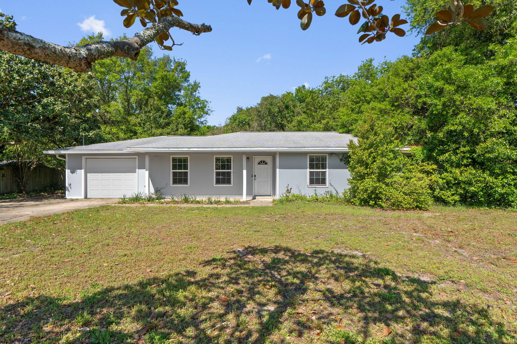 Opportunity awaits you! Fantastic investment/flip, or great opportunity for owner-occupant to walk in with instant equity & make this home their own. This home sits on a large, level 100' x 200' lot with many gorgeous mature oak trees. Plenty of parking space with 1-car garage & extended driveway. Interior features wide open living/kitchen/dining with plenty of natural light. 3 bedrooms are all generously sized, & master bedroom features attached full bath and walk-in closet. Covered back porch & expansive backyard offers great outdoor living space. HOA includes so many incredible amenities! Roof 2012; windows, electrical & water heater 2018; HVAC 2022. This property is distressed & in need of some TLC, but there is an opportunity to make this diamond in the rough shine!