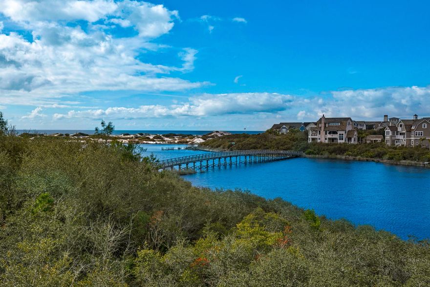 A Waterfront position with Sunset views across the Lake out to the Gulf, all enjoyed from an open Living/Dining/Kitchen and wrap-a-round porches and balconies! Level 1 host the Master Suite with Water views as well along with 2 Guest Rooms with en suite baths. A ''grandfathered'' Jacuzzi provides the ultimate in relaxation in a screened porch with Waterviews. Level 2's Living areas entertains a screened porch with Summer Kitchen conveniently located adjacent to the Kitchen. The 4th Bedroom Guest Suite also occupies this 2nd floor. The many varied amenities of Watersound Beach include kayaking & yolo boarding out your front door, resort style community pools and Beach Club, Golf, Fitness Center and of course a the Sugar white sandy Beach!