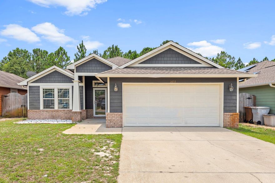 HIGHLY MOTIVATED SELLER! Price reduced to adjust to market conditions. Beautiful craftsman style home in the desirable community of the Cottages at East River in East Navarre! Located only 15 min to Hurlburt Field and within 5 min of Navarre Beach! This home boasts a ton of upgraded features that make the home feel high-end such as an updated HVAC system (2020), new Black GE Appliances (2019), stunning wood-like LVP throughout the common areas, and a open space kitchen overlooking the living space with a huge hop-up breakfast bar making it great for entertainment. Nice large backyard with a covered patio completely fenced in for the entire family to enjoy during these beautiful summer days and conveniently located only 1 mile from Navarre HS just in time for school!