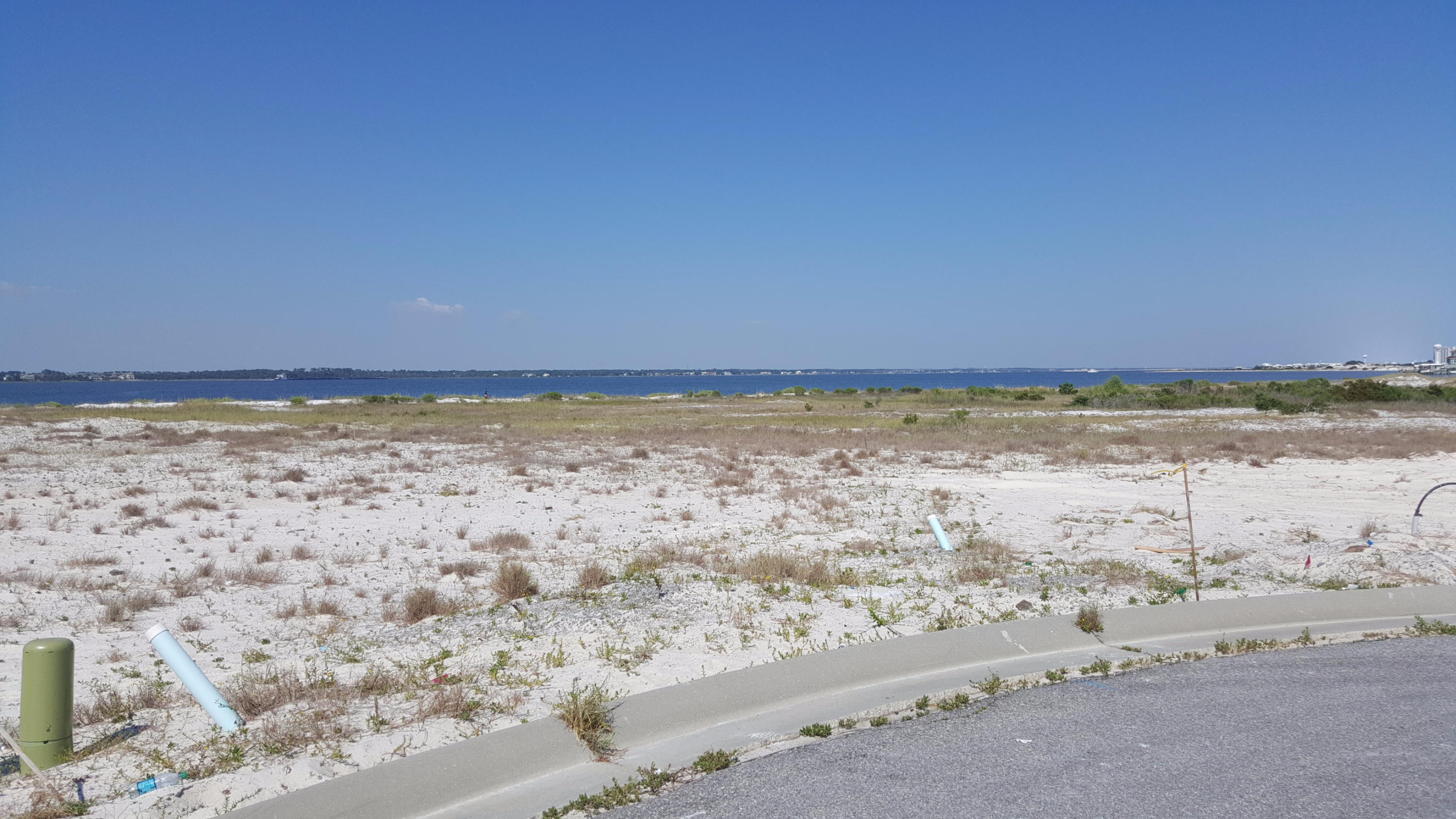 Beach living with ample garage space? With closet space? Say it isn't so! Check out the Bimini floor plan. Go watch the sunset on the deeded sound access, raise a glass, and toast your new beach home, with 4 bedrooms, 4.5 baths, and plenty of room to just be you. Enjoy the beautiful granite countertops, and the gourmet kitchen, while you cook the fish you just caught. You, too, can live on the beach year round. Why not, when this community is less than a half a mile from USA Today's #1 Rated Beach in Florida! Quality construction, very little yard work, beach lifestyle; how can you go wrong? Navarre Beach is growing. Don't miss your chance to buy at this price! Pictures, photographs, colors, features, and sizes are for illustration purposes only and will vary from the homes as built