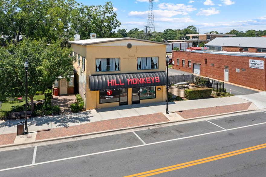 PRIME COMMERCIAL REAL ESTATE!This property consists of three parcels located downtown Main St Crestview, FL. Beautiful and well maintained two (2) story building known as Hill Monkeys Restaurant is for Sale with furniture, fixtures and equipment. This location has a private parking area, fenced outdoor patio and an upstairs with office, bathroom, storage, bar area for private events or additional dining.Main St offers various shops, downtown attractions and events throughout the year. Come check out this location for your next business opportunity.