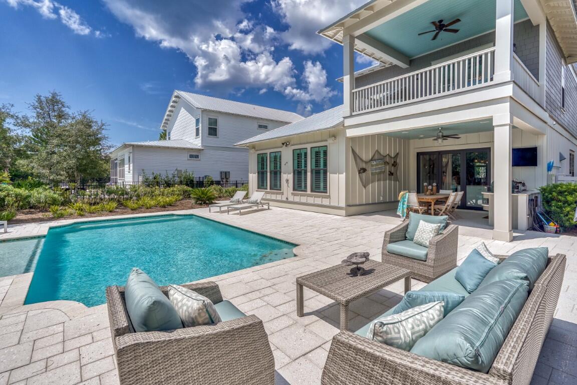 Discover the luxurious 30A coastal lifestyle from this peaceful haven. This exceptional property is positioned on a beautiful street which backs up to the nature preserve. This stunning getaway can be a top-producing investment property with rental projections at $211,600 & cash on cash return projections at 6% per year. Beautifully designed, the home offers a modern blend of indoor and outdoor living spaces. Serving as a perfect seaside retreat, 134 Walton Gulfview features exclusive deeded beach access, an outdoor kitchen, outdoor fireplace and a private heated pool. The chef's kitchen showcases Thermador appliances and quartzite countertops. Positioned just minutes from Alys Beach, Rosemary Beach & Seacrest Beach, this home sits in the perfect location to enjoy a peaceful sanctuary while also being close to all the top dining, shopping and entertainment options on the east end of 30A. The heart of this home is the expansive first floor great room along with the amazing outdoor dining area. The first level features an elegant primary suite. The second floor offers two additional primary suites. And the top floor has a gorgeous built-in bunk area. Each bedroom has their own ensuite bathroom. And the property boasts multiple balconies and covered porches. Offered fully-furnished, this property can be a lucrative investment property and comes with strong actual rental history. Explore a sanctuary designed for relaxation, connection and unforgettable memories on the coast.