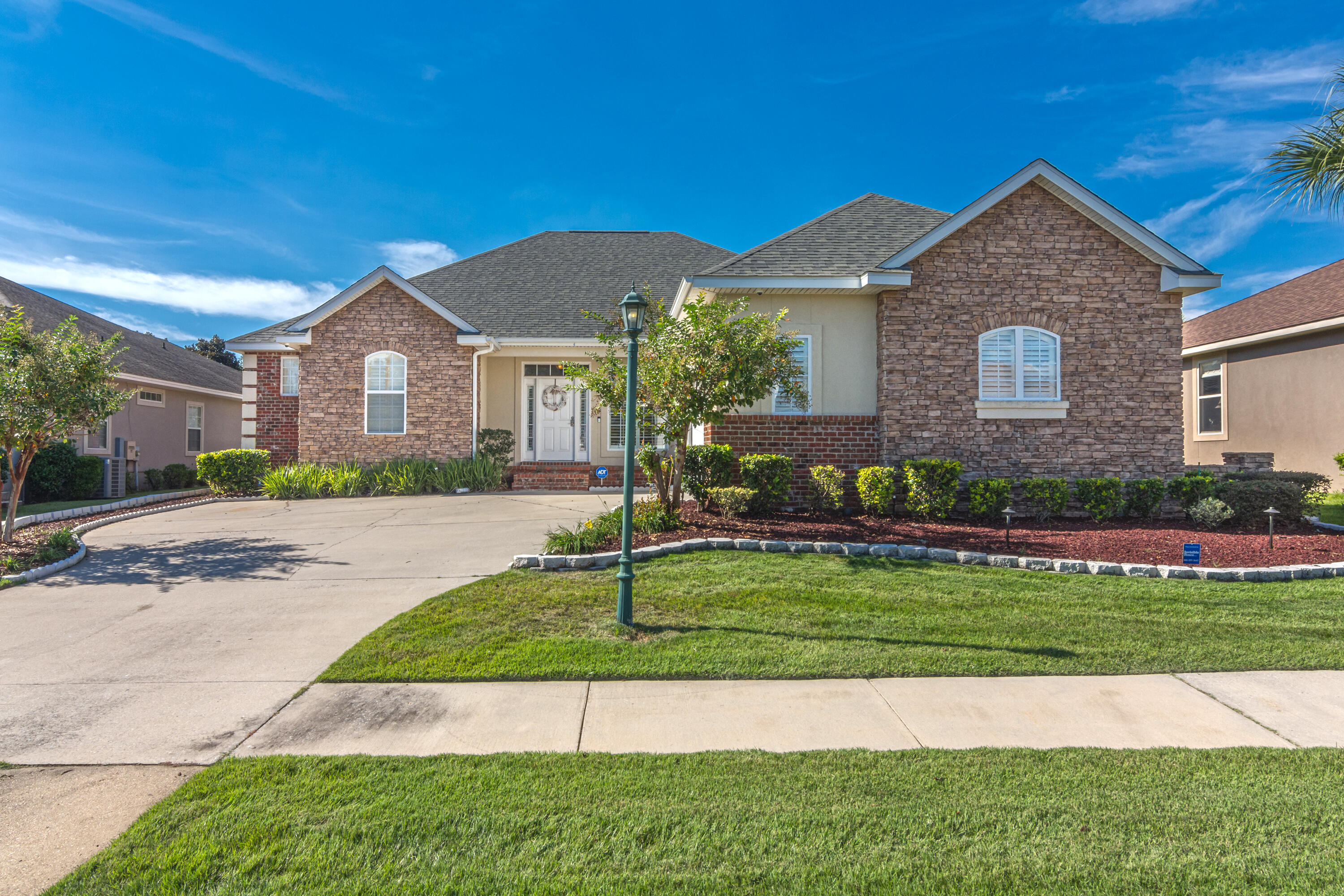 Seller will provide brand new roof prior to closing for this Award Winning Custom Built Home in the gated community of Chanan Estates! This 4/3 2300 sq ft home boasts all the amenities and upgrades you can dream of, from the custom cabinets and high end appliances in the kitchen to the brand new flooring throughout the great room, 10' tray ceilings, and the wet bar in the butler's pantry really set this home apart! Walk out to your screened in back patio with an added deck from the great room, or the master bedroom. Master bath has garden tub, separate shower and huge walk in closet! Yard is fully sodded with a new sprinkler system. The home also comes with landscape lighting that makes the home look luxurious in the dark! There's also a security system and an invisible fence for the pups!