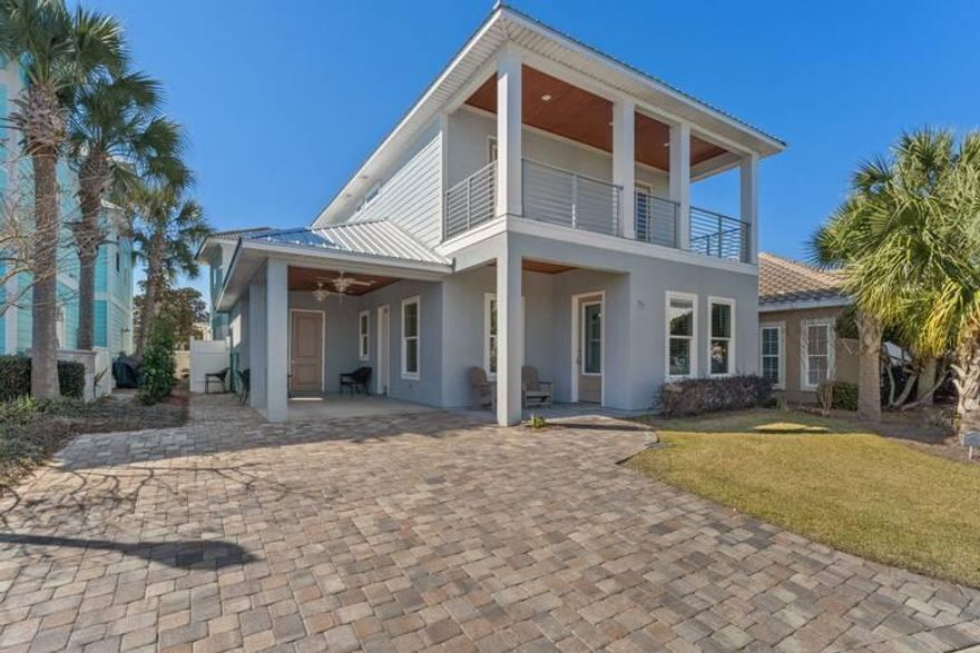 WOW, THIS IS IT!! A stunning and meticulously maintained custom built home that still feels brand new!!  A unicorn rental in flawless condition that has been a cash flowing machine while serving as a dream vacation destination for guests!  Gross rentals in 2021 were over $95K with owner usage!  The home comes fully furnished and is turn key ready! Stately wrought iron gates usher you into this exclusive community located just 1.5 blocks from the beach!  You'll LOVE that the 2022 Bintelli Beyond 6 passenger golf cart with an upgraded lithium battery CONVEYS WITH THE PROPERTY!!  Getting to the beach, pool, and around town will be fun and super easy! The home has 2 primary suites (one on the first floor), 2 living areas, 2 utility/laundry areas, and 2 beverage refrigerators!  Featur include a tiled living room wall, a stainless apron sink, an under counter ice maker, and the coolest bunk beds in the neighborhood nestled against a beautiful wood plank wall with plenty of room to add a second full size bed underneath!   Enjoy a cold beverage or a morning cup of Joe while relaxing on one of the many covered porches and decks!  A huge storage room off the carport offers tons of room to store your paddle board, beach chairs, umbrellas...all the things!!  The foam insulated attic has decking that provides additional storage space as well.  This home is NOT in a flood zone so no flood insurance is required! Overflow parking is available just steps away from your front door.  This beautiful community has 2 pools and low quarterly dues!  Whether you're looking for an awesome investment property or you plan to occupy as your primary or secondary residence, this home has it all and is a beautiful choice!!  Welcome Home to 77 N St Francis Drive!