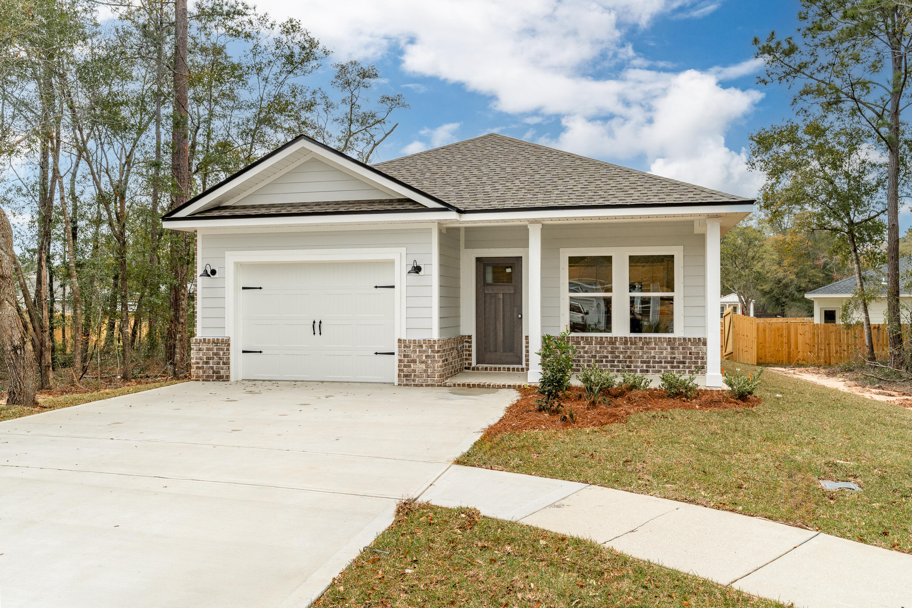 BUILDER/LENDER WILL CONTRIBUTE UP TO $15,000 TOWARDS CLOSING COSTS (restrictions apply-call for details-preferred lenders only). CRAFTSMAN STYLE 1314 SF home, 1 car garage, sprinkler system, fully landscaped with privacy fenced backyard, covered front and rear porches for relaxing! Open family/dining/kitchen with raised ceilings and recessed lighting. Work island offers bar seating and has quartz or granite countertops. Large walk-in pantry, stainless steel appliances and white shaker cabinets. Owners' bath has tile shower, double vanities, walk-in closet plus linen storage. Luxury vinyl plank flooring throughout. Builder offers 1 year builder warranty. Ready now. Interior photos of similar sold home-colors will vary.