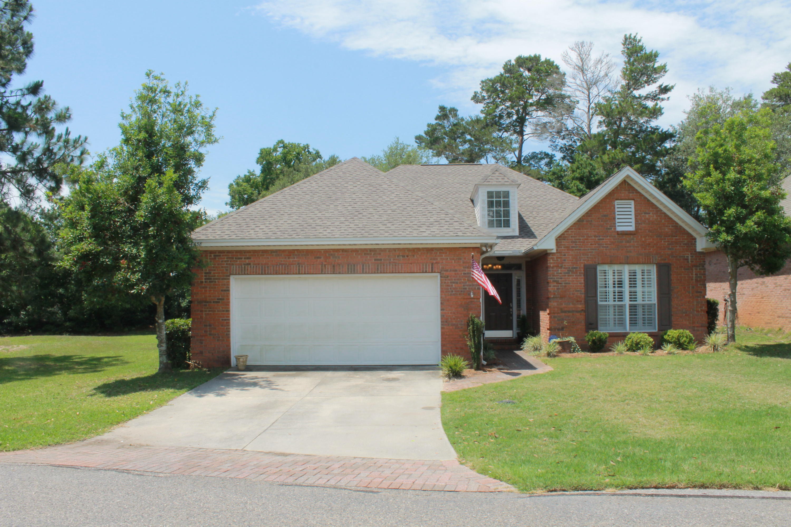Nestled on the largest lot in the Turnberry Place subdivision, is this charming traditional brick home built by Chateau Homes of Atlanta. Turnberry Place is a fine neighborhood characterized by well-cared-for homes and its park-like setting adjoining the Lake Course at Bluewater Bay. This lovely home boasts numerous upgrades throughout including granite countertops in the kitchen, stainless steel appliances and tile backsplash. Travertine tile flooring in the kitchen, dining area, baths and foyer; hardwood floors in the great room; and frieze carpet in all the bedrooms make for easy maintenance. The extra deep windows add charm and light and are enhanced by plantation shutters. Contact rental office to see this home today 850.389.8533