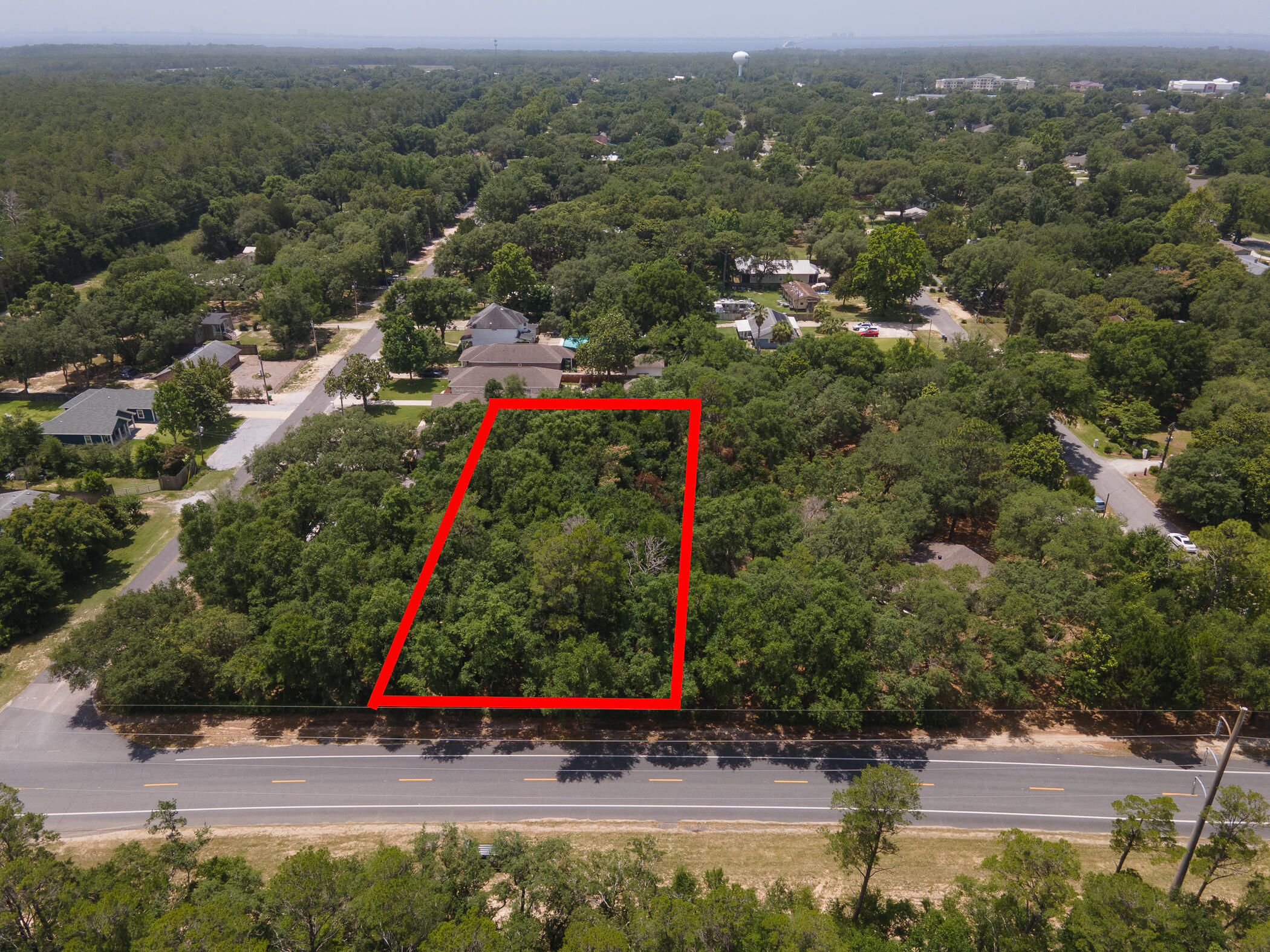 Rare find and a Great Opportunity to own a large lot in Seminole! Large lot ready to build! Water tap is in and building plans will convey to buyer with the right offer! Located between Pine Street and Cedar Street and across the street from EAFB Owned property (that has biking trails, a creek and lots to do for the nature enthusiast) Enjoy everything along the Emerald Coast, you are approximately 2 miles to the bay, 1 mile to Rocky Bayou, 7 miles to the Gulf, 1/2 mile to the elementary school, 5 miles to the middle school, high school and the college. Multiple medical facilities with a 15 miles radius. Shopping, eateries and entertainment all within a 7mile radius. Want to go to Destin hop on the Toll Bridge and you will be there in 15 minutes. This lot is ready, are you?