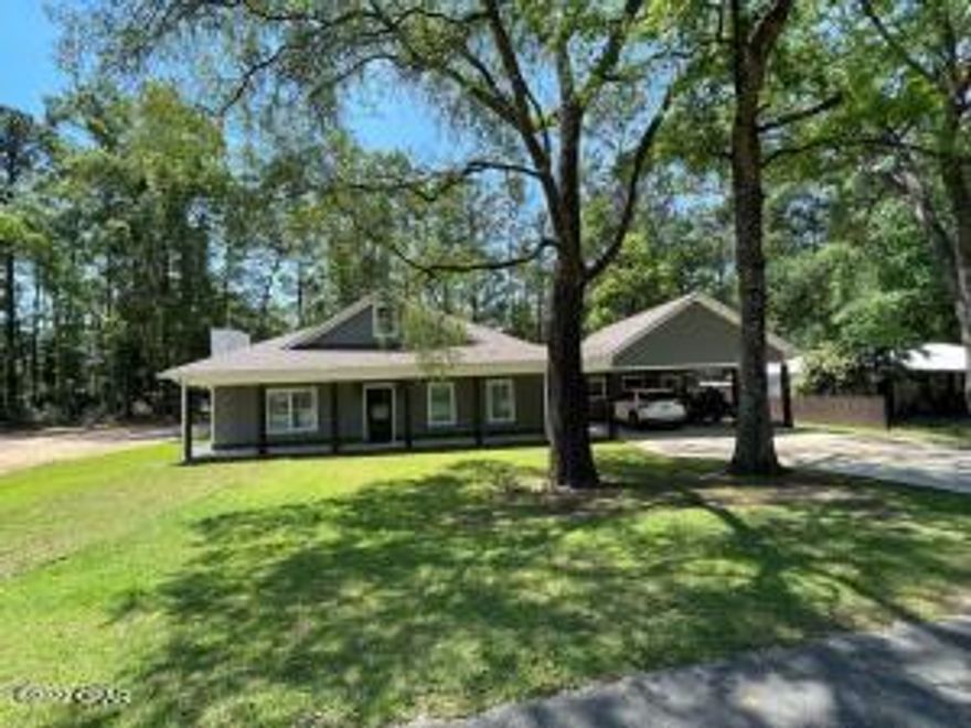 PRIDE OF OWNERSHIP! This CUSTOM Built Craftsman Style home awaits YOU to call it HOME. Located in Bonifay in a Peaceful Serene setting on a Large 140x118 lot. Beautifully manicured design with Large covered front porch , 2 Car Carport with Extra storage building or shop attached to the carport. New Sod just put in front yard. Back yard is both Spacious and Private with a Large covered Back Porch for grilling and enjoying Florida Breezes. Extra High Privacy Fence installed not long ago. LARGE CLEARED LOT NEXT DOOR GOES WITH THE SALE. Build your dream Shop or another home for family. Once inside the OPEN concept combination Living room Kitchen enjoy the warmth it provides. Nice large Fireplace, Trey extended Ceiling with Track lighting.