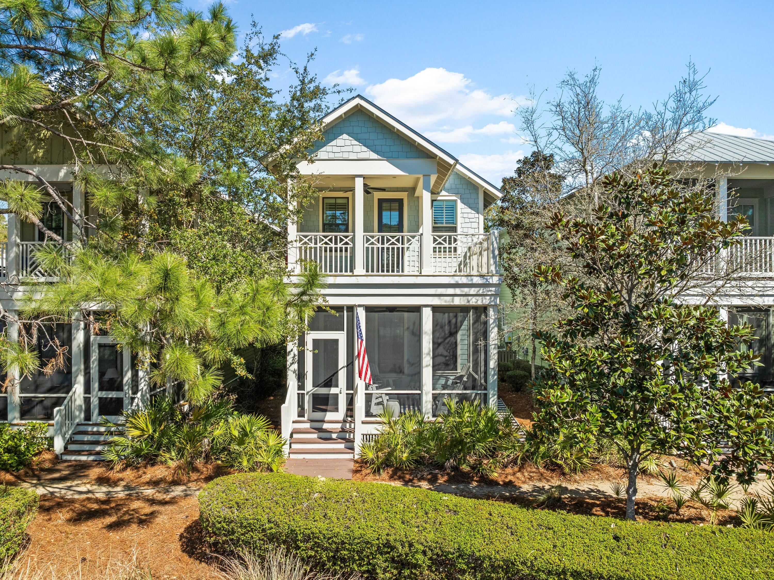 Located just steps from the Dragonfly Pool, this beautifully maintained home offers a rare opportunity to own in WaterColor. Designed for both relaxation and entertaining, the thoughtfully designed open floor plan includes a first-floor owner's suite, two spacious living areas and hardwood floors throughout. The home is being sold furnished, making it a perfect choice for a primary residence, second home or rental investment.  Outdoor spaces are designed for effortless enjoyment, with a large screened porch on the first level and a second-floor balcony providing ideal spots for morning coffee or evening gatherings. Recent updates include a newly built deck and fresh paint, ensuring a move-in-ready experience. High-end appliances add to the home's modern conveniences.
