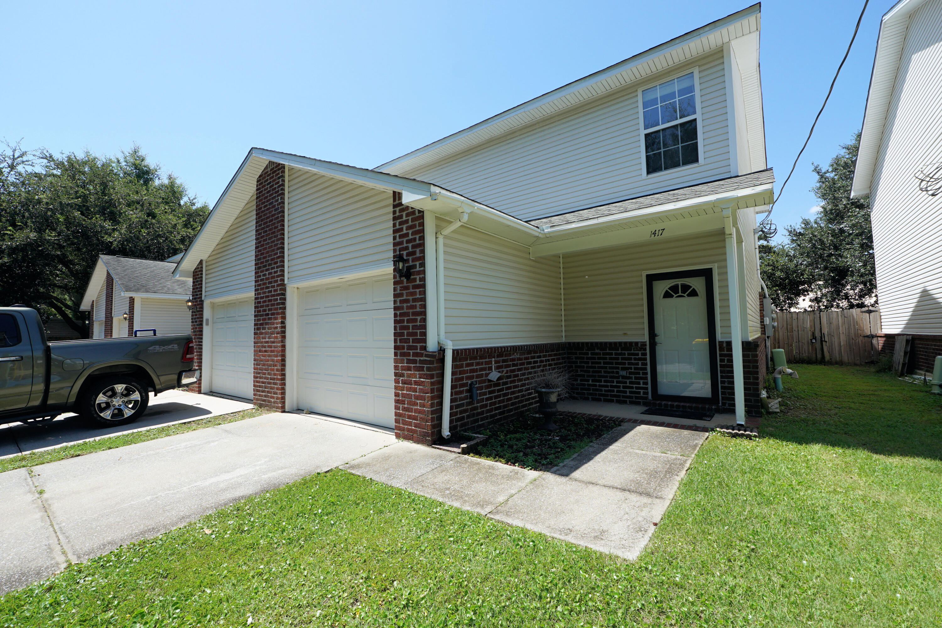 This End Unit townhouse with NEW flooring and fresh paint in south Niceville convenient to everything! The open floor plan downstairs features a living/dining room that is open to spacious kitchen boasting solid surface counters and plenty of cabinets. Upstairs you will find the master bedroom suite along with two additional bedrooms and another full bath. The master bedroom also has a bonus alcove perfect for your computer desk. There are sliding glass doors leading from the living area to a back patio and a fenced yard that is perfect for kids and pets alike. You will also enjoy having a spacious one car garage for all of your storage needs. This property would make a great primary home, second home and/or an investment property! Come see it today.