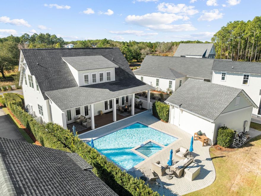 Set against a backdrop of golf course views and serene green space, this beautifully crafted four-bedroom, four-bathroom home in the coveted Watersound Origins community offers a perfect combination of luxury and privacy. Designed by Romair Construction, the residence features a large, private lot with a saltwater pool, a detached two-car garage and an expansive driveway. This property offers the rare feeling of seclusion while being just moments from the vibrant amenities of the neighborhood.  Inside, the home radiates sophistication with plantation shutters, hardwood flooring, and a spacious layout that seamlessly connects the living, dining and kitchen areas. The chef's kitchen is a masterpiece, equipped with high-end Thermador and Bosch appliances, a Sharp microwave drawer, quartz countertops and designer cabinetry. A luxurious master suite on the first floor provides a peaceful retreat, while generous porches offer ideal spaces to relax and enjoy the tranquil surroundings.  

Watersound Origins offers an exceptional lifestyle, complete with access to a community pool, fitness center, tennis and pickleball courts and a nine-hole golf course. Nature enthusiasts will appreciate the miles of trails and dock access to Lake Powell. With easy connections to 30A, Panama City Beach and Santa Rosa Beach, this property combines exclusivity and convenience. Whether you're seeking a full-time residence or a second home, this elegant retreat delivers on every level.
