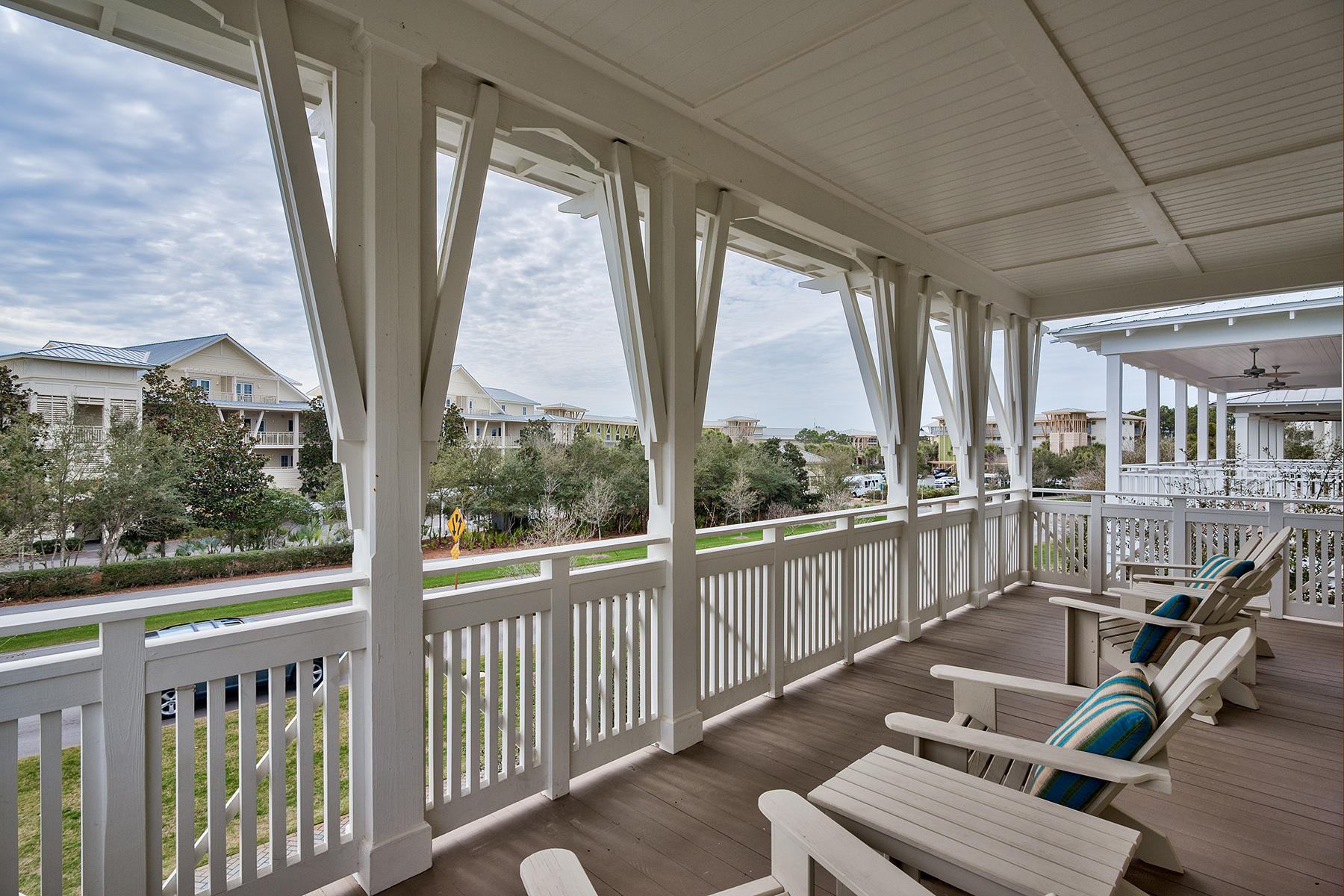 Don't miss this centrally located, spacious, and impeccably maintained WaterColor oasis right on Scenic Highway 30A. Fully furnished and turnkey ready with high-end, designer dcor, lighting, and furniture- this elegant coastal gem could be your dream beach home! The main level has 12' ceilings with transoms above for plenty of natural light. Beautiful hardwood floors can be found throughout the home plus many trim details on the interior and exterior. Walk through one of the many screened-in porches into the large downstairs living room perfect for entertaining. The adjoining gourmet kitchen is to die for with honed granite countertops and Sub-Zero and Wolf appliances, complete with a wet bar that includes a wine cooler, icemaker and plenty of storage.