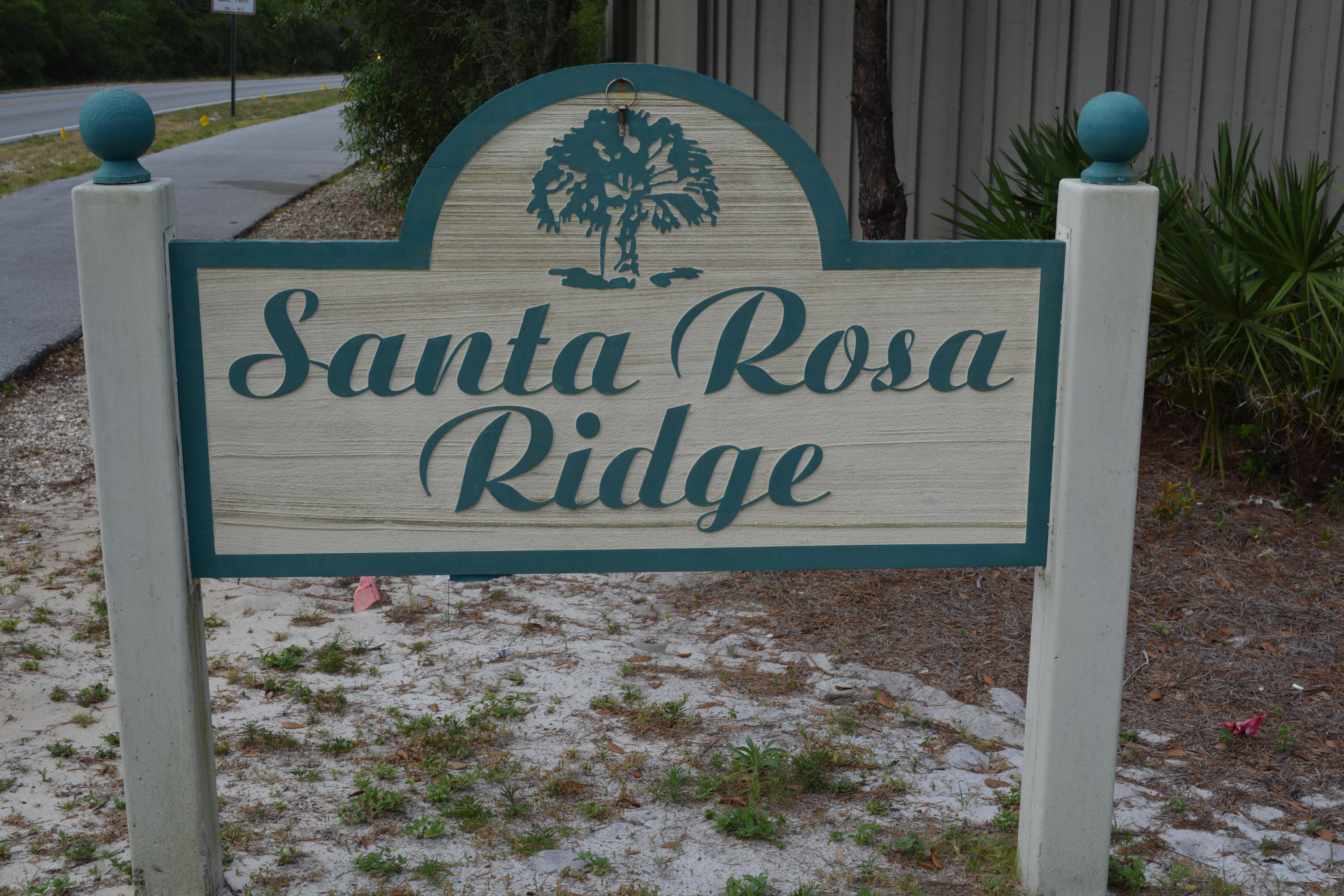 Beautiful home site with high elevation in the quaint neighborhood of Santa Rosa Ridge is perfectly located South of 98 and convenient to all that the West end of 30A has to offer. Design your weekend retreat or personal home from the top down to take advantage of the opportunity to build to today's construction codes and standards as well as your family's lifestyle. This community is located approximately .7 miles from the public beach access where you can dig your toes in the white sandy beaches or take a dip in the emerald green waters. Hop on the 30A bike path and see all that 30A has to offer including boutique shops, casual and fine dining, entertainment and golfing. You will enjoy the feeling of seclusion with the ability to bike or walk to nearby restaurants, shops and banking
