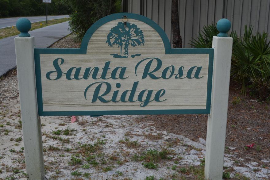 Beautiful home site with high elevation in the quaint neighborhood of Santa Rosa Ridge is perfectly located South of 98 and convenient to all that the West end of 30A has to offer. Design your weekend retreat or personal home from the top down to take advantage of the opportunity to build to today's construction codes and standards as well as your family's lifestyle. This community is located approximately .7 miles from the public beach access where you can dig your toes in the white sandy beaches or take a dip in the emerald green waters. Hop on the 30A bike path and see all that 30A has to offer including boutique shops, casual and fine dining, entertainment and golfing. You will enjoy the feeling of seclusion with the ability to bike or walk to nearby restaurants, shops and banking at Gulf Place.  Purchase now and when the timing is right for you, build your dream home.
