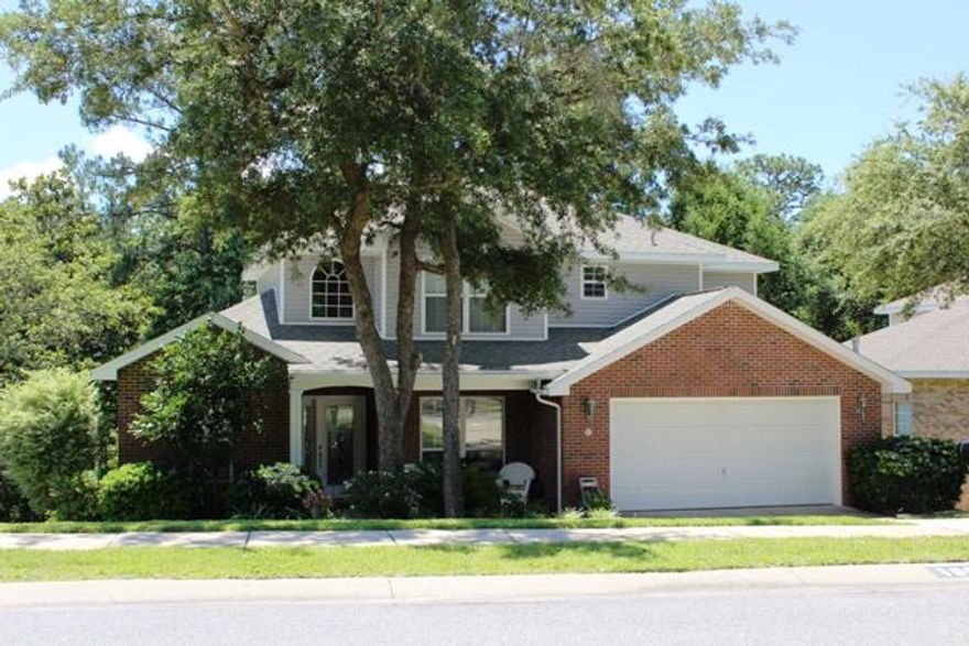 Seeing is believing...this BRICK two-story home sits on one of the best lots in Woodridge. The view from the backyard is a tree lover's paradise and will stay that way! Home features 4 bedrooms and 2.5 bathrooms with 2,273 square feet of living space. Dining room space which could easily be an office with entry from the foyer and living/kitchen area. Two story ceilings in the great room with the focal being the backyard view. Kitchen has an oversized island and an abundance of storage with an upgraded all wood pantry. Master bedroom features a trey ceiling, master bath with a double vanity, separate garden tub for soaking and a standalone shower. Large walk-in closet to accommodate both the Mr. and the Mrs.