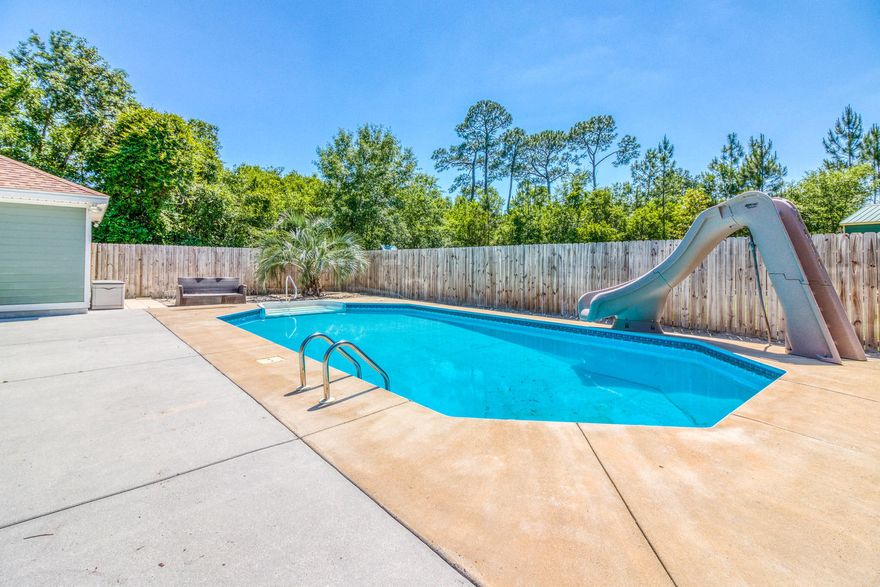 Mini Estate. Beautiful Custom Built home on just over an acre of land. This gorgeous country home is only 7 miles from the water. Get away from it all without the long drive. This mini estate features a large metal building that could be used as a shop, for storage or whatever your hearts desire. It also features an inground swimming pool with a large deck area. Your own little oasis for friends and/or family. The interior was thoughtfully laid out. As you enter the home you have the formal dinning on the right that could double as an office. Just past that is the spacious living room is large enough to spread out in even for large groups. You look through the living room for the beautiful views of the covered leni and pool. These are not the only views. You can also enjoy the pool from