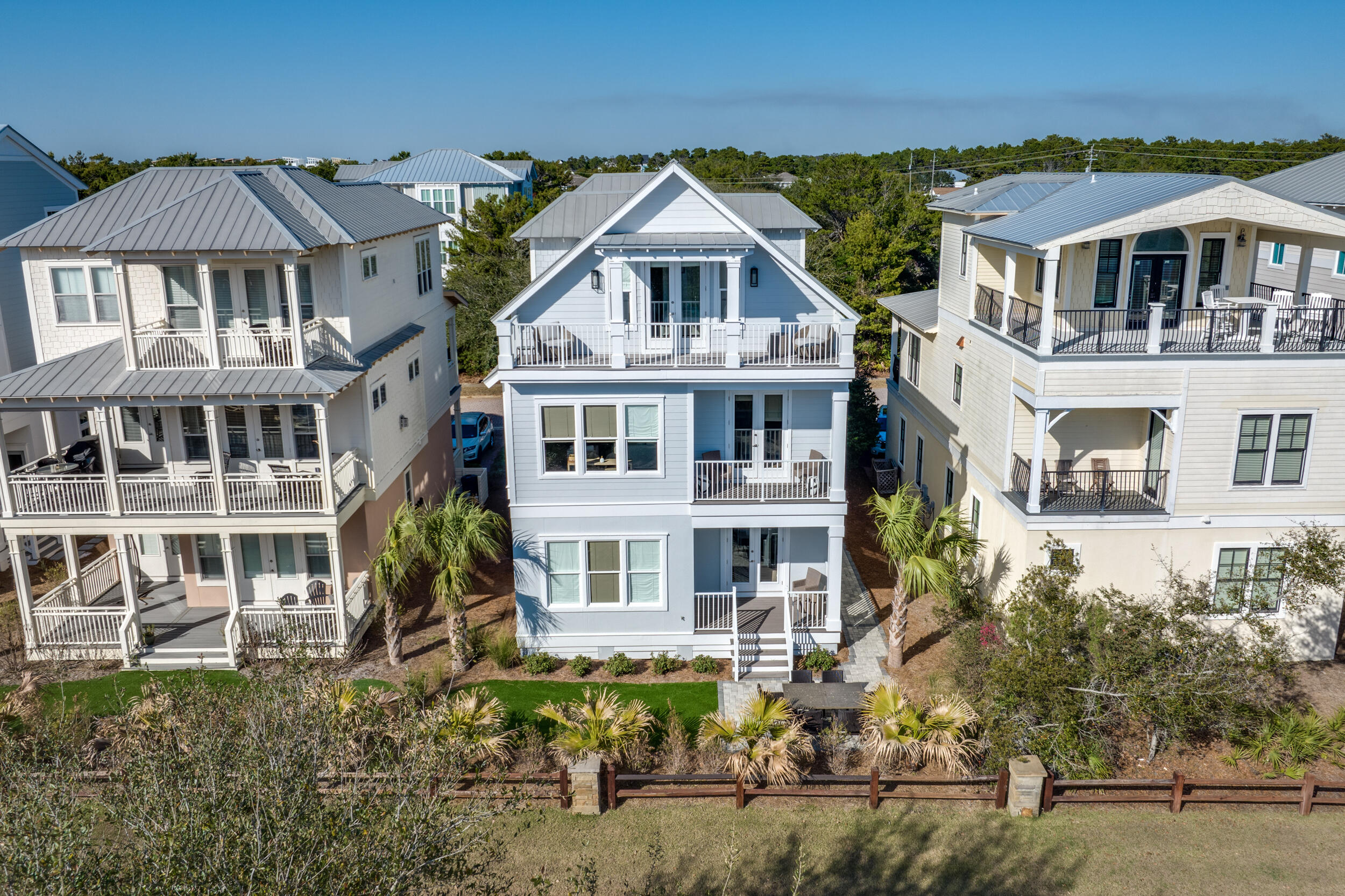 This completely renovated home is just a block from the Orange Street beach access. This gorgeous custom home has gulf views and plenty of living space, great for a vacation rental. Four bedrooms each with an ensuite bathroom. The open kitchen has new countertops and freshly painted cabinets and custom tile, the home has brand new European white oak hardwood flooring, new master shower tile bathroom and shower, all new tile in all bathrooms, new brick paver driveway, complete exterior paining, turf backyard, new elevator. Owner spared no expense on full remodel. Ride your bike to Rosemary, Alys and Seacrest Beach and just a mile to the shops and restaurants and the Shops a 30 Avenue. Interior and exterior renovations will make you fall in love with this beautiful beach home