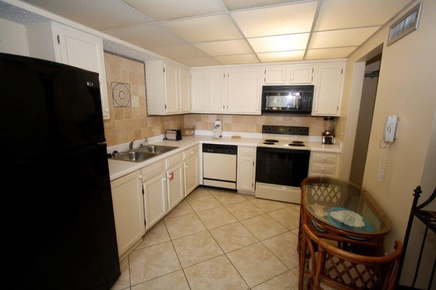 RARELY does a 3 bedroom, in the more desirable front A building come on the market at The Enclave. The Association replaced all the windows in the building within the last 3 years, painted the exterior in 2012 and replaced the roof in 2016. Covered parking is available for owners. DEEDED BEACH ACCESS is steps away! Everything you need is right here; Hugh heated pool, sand volleyball, basketball, 2 tennis courts & fitness room.