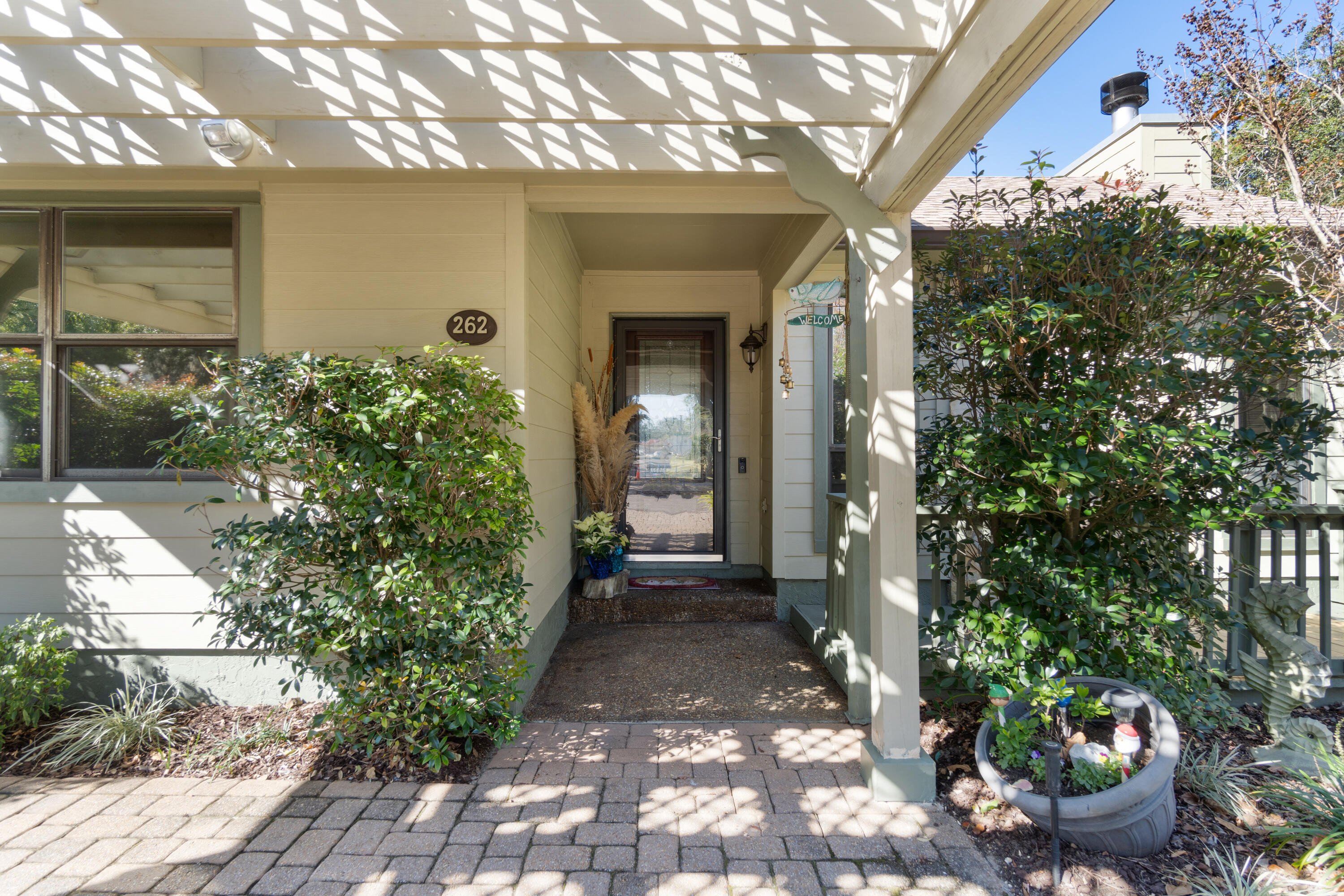 This Beautiful Townhome on Cinco Bayou is a must see providing a welcoming entrance with a 2 car carport and front patio. The Family Room has a vaulted ceiling including an inviting Fireplace that soars to the ceiling. The expansive Deck overlooks the yard and docks. You will find the spacious Kitchen offering plenty of Cabinets and gives you another view of the yard. There are 2 Bedrooms and a Bonus, 1 Bedroom is on the main floor. Both Bathrooms are ample size. The Owners Suite offers another Deck to view the yard and Bayou. The Amenities include a Beach and Fishing area for hanging out with Friends and Family, The Roof was replaced in 2020. Docks are being replaced in 2025. All Decks were repaired and repainted in 2024. There are slip's available for $50 per month for Owners only. Come see this amazing property. Overflow Parking is available too. 