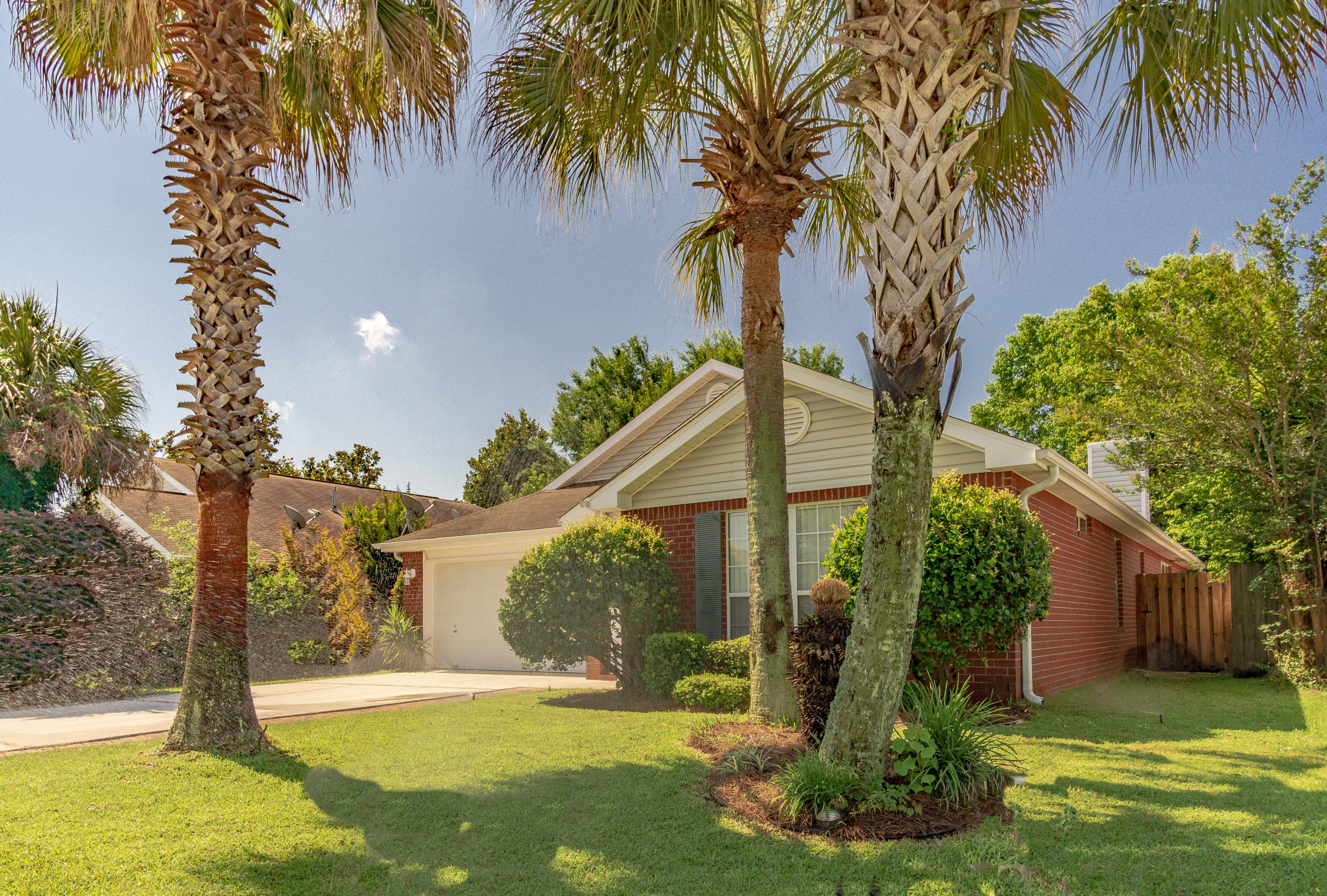 Back on the market! No fault of the seller. Freshly painted and landscaped, this gorgeous 4 bedroom/2 bathroom home is minutes from Hurlburt Field and Eglin Air Force Base! Features include an open living area perfect for entertaining with clear views throughout, eat-in dining and a huge breakfast bar. The large master bedroom offers a spacious bathroom with a garden tub, shower, dual vanities, separate toilet, and walk-in closet. The split floor plan features 3 additional, well-sized bedrooms on the opposite side of the home and has a shared bathroom, also with double vanities. Fully fenced in backyard with easy to maintain landscape! Emerald Village features sidewalks and and a convenient, central location. Be sure to watch the virtual tour!