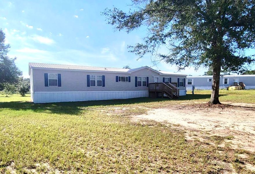 THIS IS A like new 2006 TIMBERLINE SOUTHERN ENERGY HOME, recently repainted and   is sitting on nearly one-half acre (.40 acre) with 4 bedrooms, 2 baths, with split floor plan.  Den is a bonus space for today's large families.   There is an island  in the eat-in kitchen, lots of cabinets, a built in desk for homework, sorting recipes or even paying bills. The living room is light and bright with a stone fireplace.  Master bath has a jacuzzi tub and separate step-in shower.  Master bedroom closet is gorgeous, with built in cabinet with drawers that you can walk- around in easily....This home has a  total of 2356 s.f. of living area.  Front and back deck/stairs and metal roof.  The home has been well taken care of and maintained.  Eligible for FHA, VA or Conventional financing.
