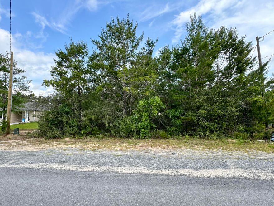 Located in the Oakwood Hills neighborhood - this lot offers an opportunity to make your new home vision a reality. With convenient access to Hwy 90 and I-10 (less than 7 miles away), you're in the sweet spot...not too close or too far from town. Bonus is that the gorgeous beaches of the Emerald Coast are only approximately 45 mins away! Power & water at the street, minimal restrictions, mobile homes allowed & no HOA. Take a look today!