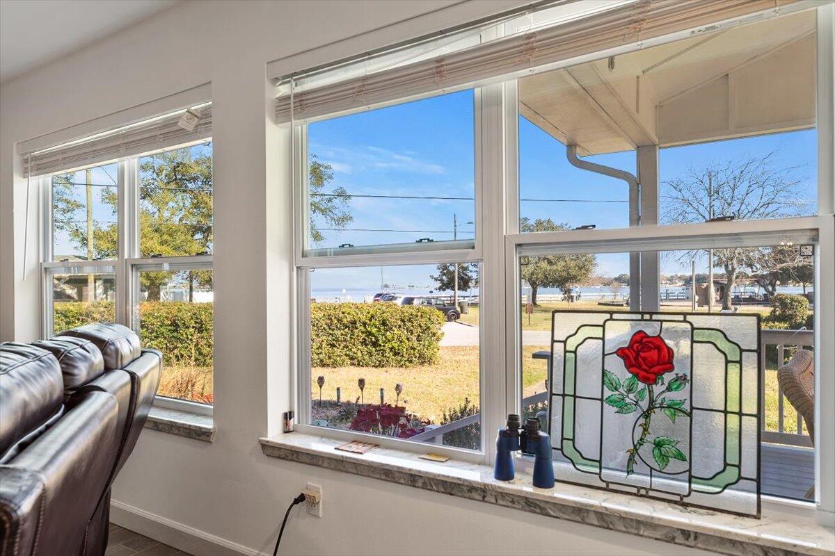 Effective Year built 2000! Forever views and priced to sell! Hello Beautiful! This 3 BR/3 BA home lives large like 2 houses in 1! Multigenerational or co-living opportunity with 2 primary suites sitting on a large corner lot across from Garnier's Beach Park and offers unobstructed bay and bayou water views from almost every room! Watch the stunning sun rises, see the sailing regattas by the FWB Yacht Club, at night see the beautiful lights across the water from your front porch or head up to the observation deck that was built above the home so you can enjoy all the views! If you are looking for a unique home that embraces the original design of the home and has been thoughtfully remastered with additional square footage including a 2nd primary suite & garage then you must see this home! SOLAR PANELS ARE PAIDOFF! The new owner of this beautiful home can enjoy the benefit of low electric bills!! Unobstructed views of Cinco Bayou, Fort Walton Yacht Club & Choctawhatchee Bay! Garnier's Beach Park features a white, sandy beach, shallow boat ramp-perfect for jet skis, paddleboards, kayaks & small sailboats, a playground and restrooms. Lots of natural light and windows to enjoy the water views! This home offers a split bedroom plan with 2 bedrooms and 2 bathrooms on 1 side of this home (which includes a primary suite and its own washer, dryer, and on the other side of the home is an oversized primary suite with walk in closet, walk-in tub and separate shower, double vanity and its own washer and dryer! The kitchen has granite countertops, tile backsplash and a butcher block countertop was added. There is even an osmosis machine for your drinking water. Attic foil was added to maximize home insulation efficiency, windows were replaced in 2017 and 2018, Roof was replaced in 2017 and then in 2020 on the solar panel side. Home was rewired in 2017. Home has gas and electric. Beautiful Oak flooring in the original part of the home and Luxury tile in the newer part and addition. Sellers previously closed off the original part of the home while they were traveling and used it as an Air B & B, a second kitchenette could be added to truly maximize that potential! Jump in your Hot tub after a stressful day! Multiple out buildings for storage in the backyard. The newest out-building would make a great tiny home! Multiple lovely outdoor spaces with orange trees and lemon trees and mature vegetation. 3 driveways for easy access for parking and 2 separate garages. This home has it all!!
