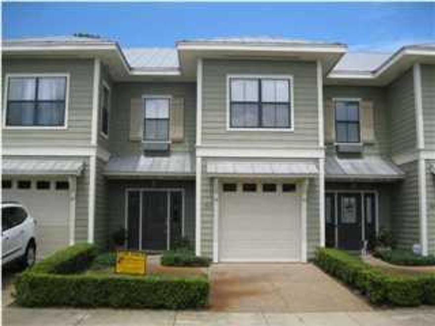 This spacious three bedroom two and half bath townhouse is centrally located to the beach, restaurants and shopping. The downstairs features a large living-room with lament flooring, the living-room opens on to a covered patio, beautiful kitchen with granite counter tops and a half bath. Upstairs you find two large size bedrooms with large walk in closets, a full bath, and a master suite with a large master bath. The owner will be putting a washer and dryer in the unit. Home also features a one car garage and a community pool to relax in after a long day of work. Hurry this one want last long.