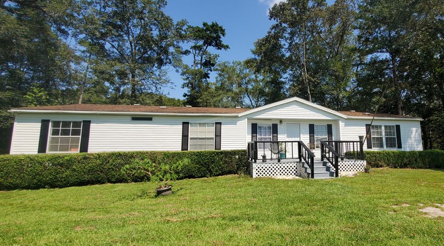 Seller taking back up offers. Do you want a whopping 660 feet of waterfront on Wright's Creek? If so, then this 20 acres of lush green land and home is your answer. You will love the tranquil country atmosphere and will be subject to frequent sightings of deer, hawks, owls, otters, cranes, and many other birds. Bring your fishing poles and get ready to catch bass, bream, stumpknockers, and catfish. New: Enter the home to the spacious living room featuring a wood burning fireplace and views to the water. The kitchen boasts an island with attached eat-in bar, all appliances convey. New: Well and pump,  HVAC 2019, ROOF 2014, dishwasher, removed popcorn ceiling, all new light fixtures and fans, high end vinyl plank flooring and carpet, molding, paint, garbage disposal, painted decks, dock and deck to creek, a/c in storage shed, water heater 2010, stove 2010.