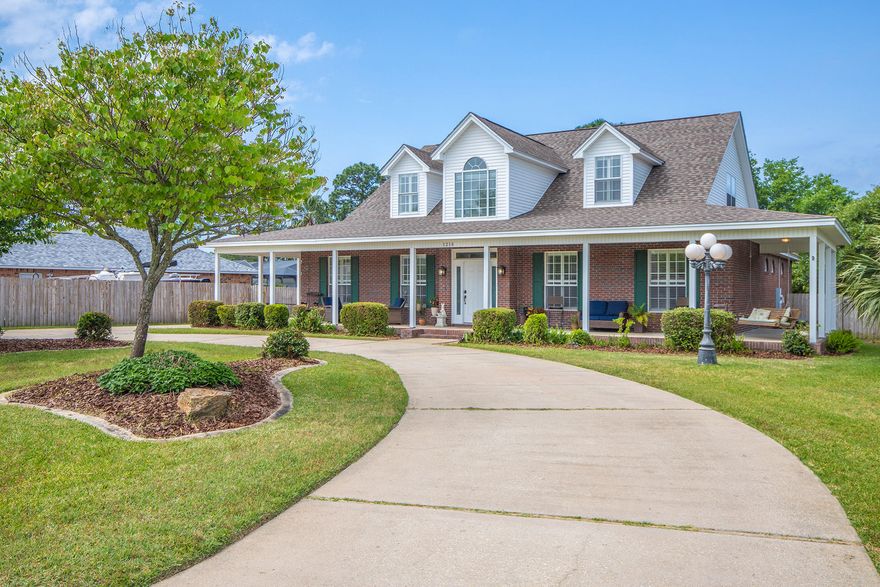 Stunning 5 bedroom, 3 bath home located in desirable Raintree Estates in Bluewater Bay!This southern bell greets you with a grand circular driveway, and classic wrap-around front porch- perfect for sipping sweet tea!The eat-in kitchen offers GRANITE countertops, beautiful cabinetry with under-mount lighting, black STAINLESS appliance package (2017), large island, breakfast bar, and walk-in pantry. Entertain in the spacious living room with cozy fireplace and custom built-in shelving, or host a holiday dinner party in the formal dining room.The master bedroom offers his & hers walk-in closets, and an en-suite bath with separate vanities, jetted garden tub, and large walk-in shower.Lush landscaped backyard with sprinkler system and 2-car detached garage. Energy saving solar panels