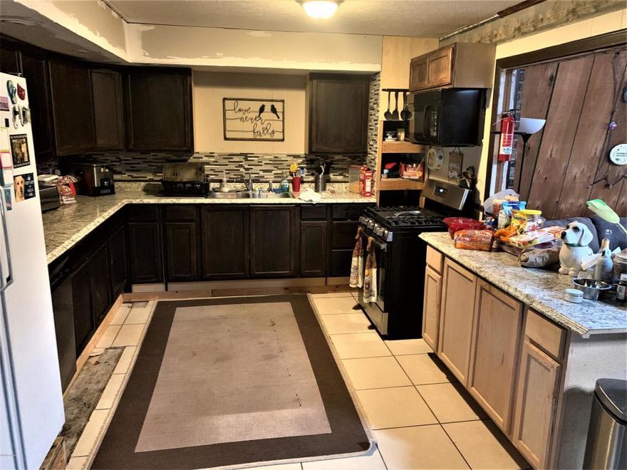 OVER 1.25 AC's Enough room to build a 2nd home for family member or to sell...This home is right next to all restaurants, shopping, gyms, nice area as alot of its surroundings have been recently upgraded or newly installed. A few features of this home is that it has some of the largest rooms you'll be seeing in the area, including a loft which isn't very common anymore. High ceilings and such a prominent prestigious feel. New roof. Wood Stove. 1st floor AC not working at this time owner put window units in.Over 1.25 ac's..Contact office for showing today!