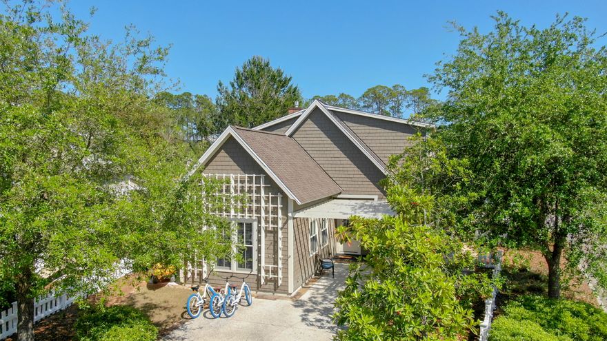 Prepare to fall in love with this charming WaterSound Beach home which has three bedrooms, four baths and a loft with bunks. The stained concrete flooring extends throughout the first-floor living area of this lovely residence and hardwood flooring completes the upper floors. The large open concept living area includes a large kitchen with a suite of stainless-steel appliances and granite countertops, providing the perfect place to hang out with guests while preparing nibbles and drinks. More delightful features include new ceiling fans, recessed lighting & outdoor storage coupled with the large corner lot make this home a wonderful investment or second home for your next family vacation.