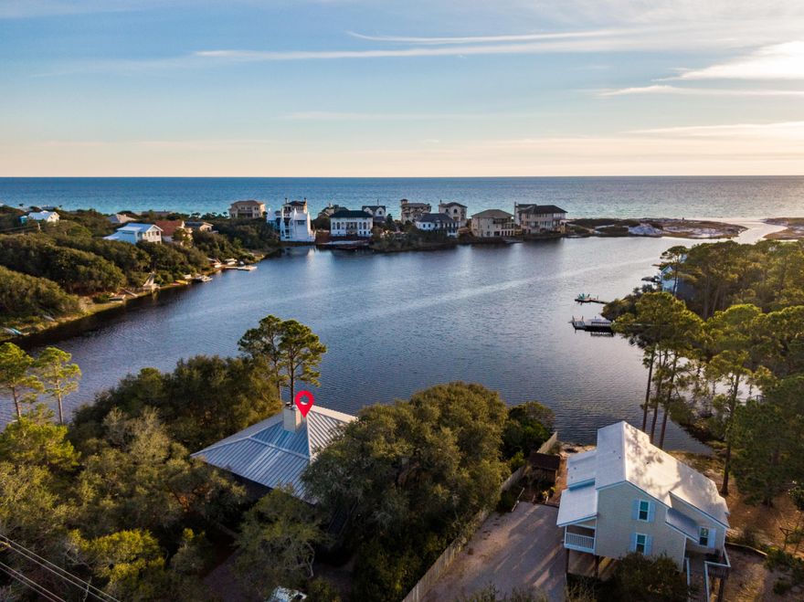 This charming 30A beach cottage boasts the opportunity to experience living on a rare coastal dune lake with panoramic views nestled amidst south walton's local wildlife. With 110 ft. of lakefront property sculpted with oaks, flowering trees and shrubs, it's easy to see why this home provides an ideal setting for canoeing, kayaking, paddleboarding, fishing and swimming with direct beach access.
Throughout the home, you'll find light-filled rooms, high ceilings providing an open and spacious feel, and expansive lake and Gulf views. The home's living space provides a fireplace along with a screened porch for entertaining outdoors or enjoying incredible Florida sunsets. This special 30A property is a mere five minute drive (or less) to Butler Elementary, Santa Rosa Golf and Beach Club, Ascension Sacred Heart Hospital as well as boutiques and restaurants in Grand Boulevard.