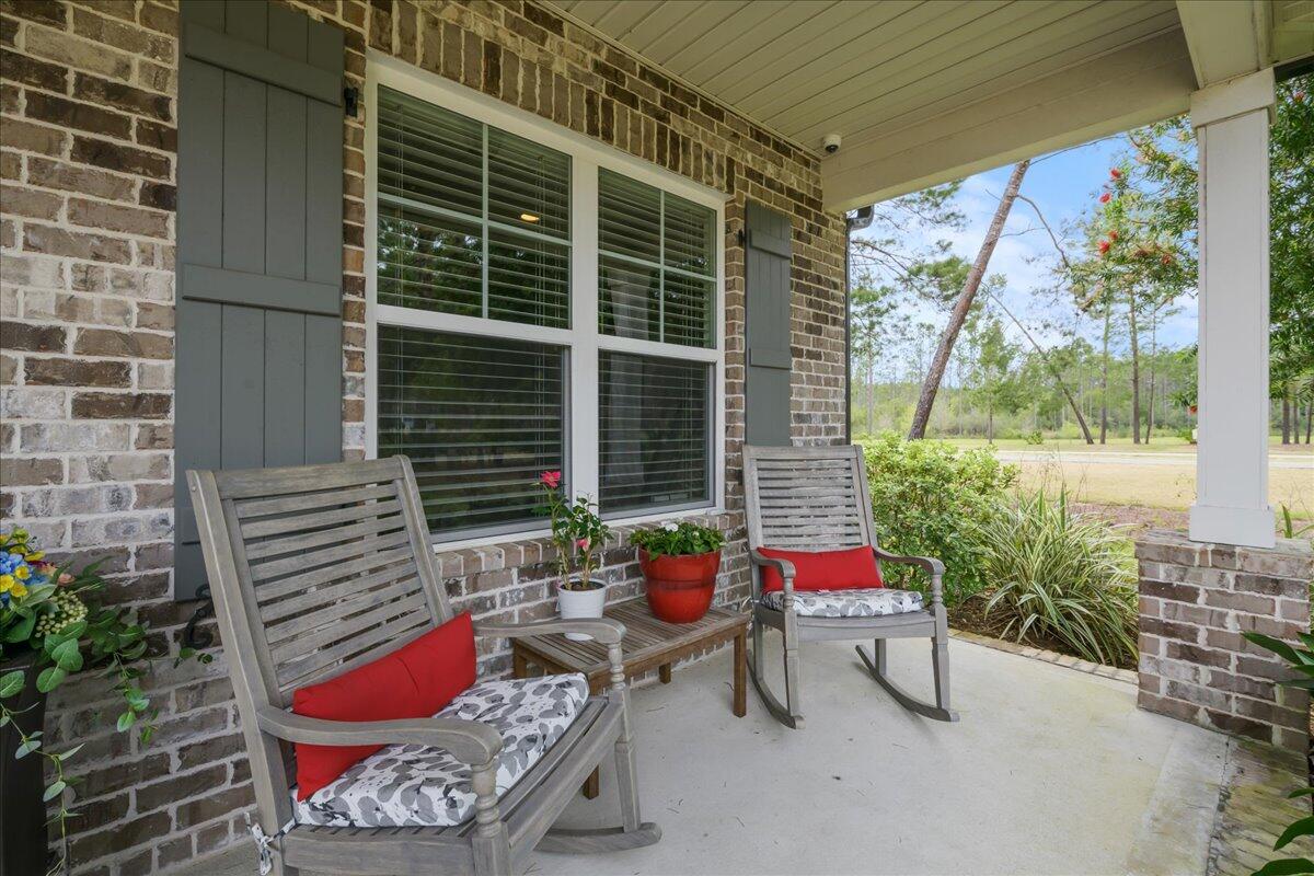 Beautiful three bedroom, two and a half bath home with a flex room. This Hammock Bay beauty features a brick exterior, 2 car garage, an amazing covered rear porch and low E-vinyl windows. In the kitchen you will find: a natural gas range, WoodHarbor cabinets with a 100 year finish warranty, stunning quartz countertops, stainless steel appliances, under cabinet lighting, and a glorious farmhouse sink. The home also features 9' ceilings, crown molding, cased windows and openings, and a Rannai tank water heater. This home is fully fenced and located in a quiet cul-de-sac in Hammock Bay, a 3,200 acre master planned development. Amenities include a clubhouse, movie theater, pools, workout facility, nature trails, and even a pet park.