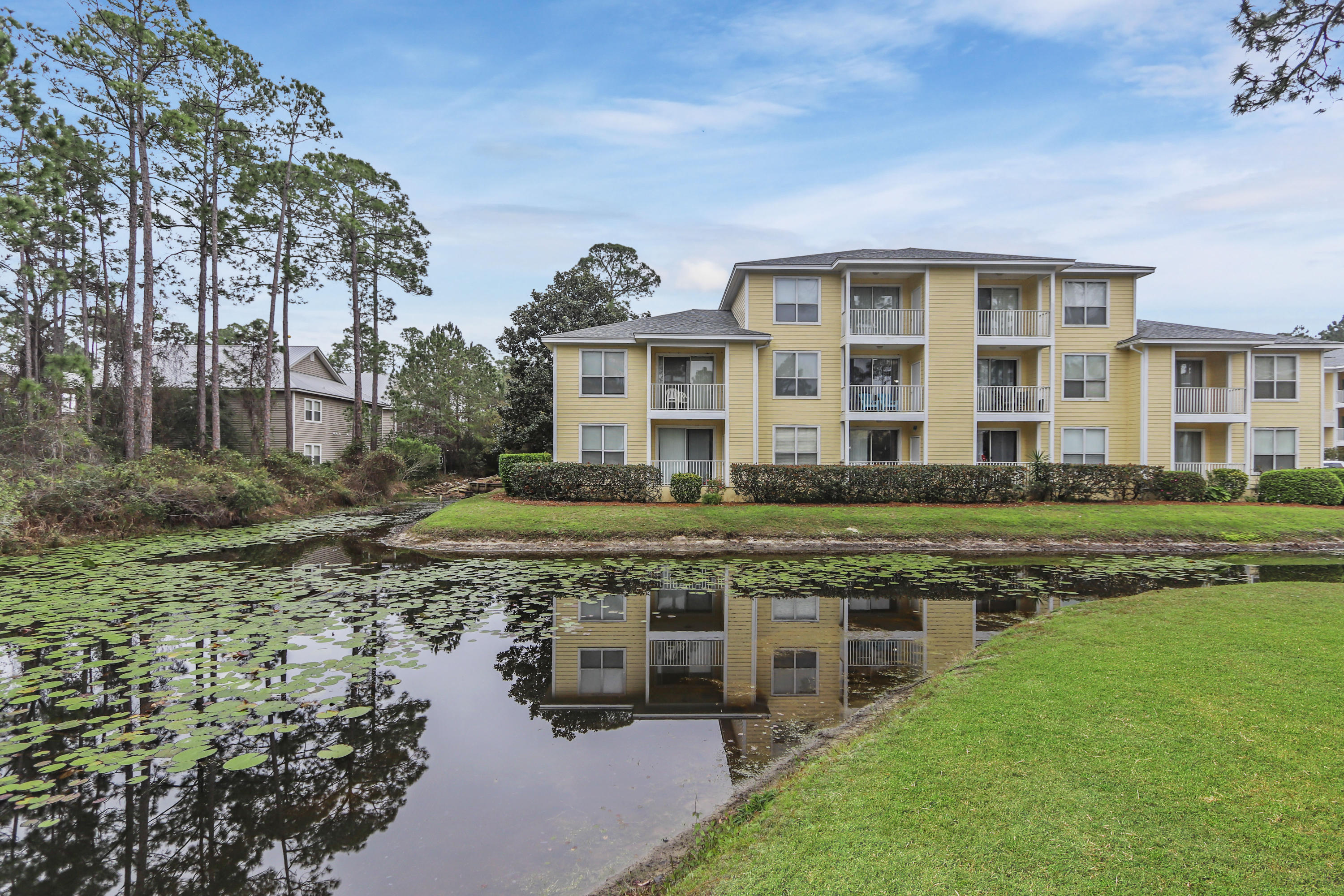 LOCATION LOCATION LOCATION- walking distance to shopping, movie theater, incredible dining, grocery store, dry cleaner, hospital, and so much more! This two bedroom, two bathroom top floor condo overlooks the water lily filled pond from your balcony and master bedroom. All new flooring throughout the main areas of the condo, kitchen completely remodeled with new stainless steel appliances and granite countertops, large laundry room with space for storage. Each bedroom has full ensuite bathroom which makes for the perfect living combination for roommates or guests! Previously rented with great rental potential. Buyers must verify all dimensions and information for accuracy.