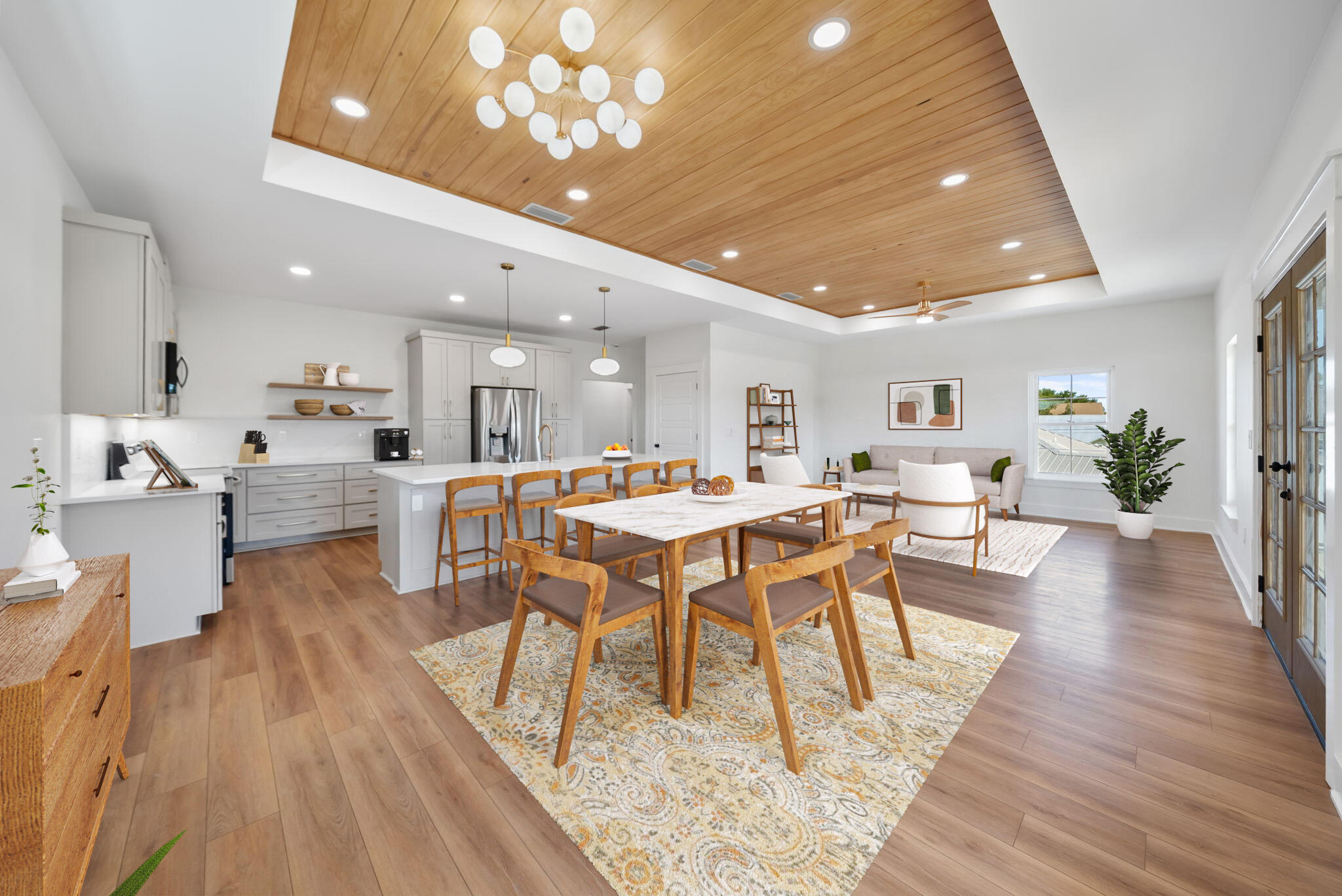Custom, coastal luxury is defined in this truly exceptional new construction, custom home in Panama City Beach, Florida. This is not your average new build--this is a stunning fusion of mid-century modern, coastal design and refined southern charm, crafted for those who seek elevated style with NO HOA and standout investment potential! Every inch of this home is a showcase of superior craftsmanship and thoughtful detail by a locally renowned quality home builder. Whether you're searching for a high-performing vacation rental, a stylish second home, or a one-of-a-kind primary residence, this property offers unmatched value, lifestyle, and return on investment. Positioned just three blocks from the sugar-white sands of Panama City Beach, this East End location places you across from the waters of the Lagoon giving access to the Bay and Gulf of America which is ideal for boating, fishing, and trips to the idyllic Shell Island. The extended driveway has room for your boat or watercraft, with public ramps only blocks away! Best of all, there's NO HOA to limit your lifestyle and rewards you with higher ROI with having lower holding costs for investment.
Step outside to a fully fenced backyard oasis built for the Florida lifestyle: custom paver patio, multiple pergolas for lounging and grilling, and a green space prepped for a future pool with plumbing and electric already installed for a seamless addition. Whether entertaining, renting, or relaxing-this backyard is the heart of beach life.
Spanning just under 2,200 square feet, this 4-bedroom, 3.5-bath luxury home includes a 1-car garage, large covered patio and a versatile layout tailored for both personal enjoyment and high-performing vacation rental income, projected at $86K+ annually.
This open concept home boasts luxury vinyl plank flooring throughout, a consistent color palette with designer tile and custom wallpaper accents, and high end finishes such as Quartz countertops, custom white oak cabinetry, tongue and groove ceilings and designer lighting. The kitchen is made for entertaining and a large living and dining are with French doors lead to a full-width covered patio-perfect for morning coffee or evening cocktails after the beach.
Three bedrooms and two full bathrooms on the lower level offer comfort and flexibility, including a built-in bunk room kids will love while the upper level has the primary suite and a convenient powder room. The oversized primary suite is a serene escape featuring a tongue-and-groove tray ceiling, custom built-in closet, designer sconces and a spa-worthy en suite with white oak vanity, and a mid-century modern stunning walk-in shower.
A highly desired garage is also crucial at the beach and in this location around the corner from the boat ramp. You'll love the additional storage for beach chairs and umbrellas, pool floats, fishing rods and reels and even a golf cart! The clever under-stair storage inside is also ideal as an owner's closet for rentals or for additional storage of beach gear!
Rick Seltzer Park is 3 blocks away and an excellent public beach access for this home with plenty of parking, restrooms and showers!
This home is also within excellent proximity to local restaurants, shops, and entertainment, this home is more than just a place to stay-it's a destination in itself. You'll love sunset dinners at Schooners, playing mini golf at Coconut Creek, visiting Ripley's Believe it or Not on rainy days and fish tacos at Finn's! Don't miss your chance to own a rare, custom-built gem in one of the most desirable and fastest-growing areas of Panama City Beach.