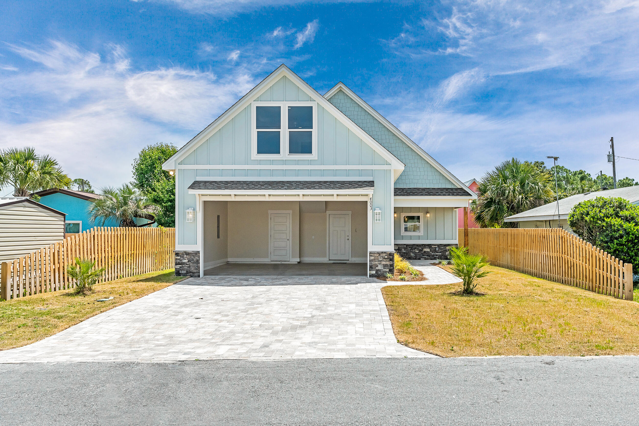 New construction two-story home offering coastal living with versatile layout. Main level features open concept kitchen, living and dining areas connected seamlessly. Perfect as a vacation rental property (no short term rental restrictions), second home or primary residence.First floor showcases a kitchen with custom wood cabinetry, granite countertops, stainless steel appliances (Dishwasher & Oven) and a vented range hood. Durable LVP flooring extends throughout, complemented by crown molding in first level living spaces and bedrooms. Master bathroom features an elegant tiled walk-in shower with rainmaker shower head, while the full guest bathroom offers a tub/shower combo. Convenient half bathroom off the main living area adds functionality for family and guests and a dedicated laundry room is located off the kitchen. Second floor bonus room provides flexible space ideal as a 4th bedroom, home office, media/game room or additional living area.
Exterior features include durable fiber cement siding with stone accents, a shingle roof and spacious two-car garage accessible via brick paver driveway. Outdoor living options include a large covered front porch, covered back porch with ceiling fan and huge backyard - all fully fenced with an automatic Rainbird irrigation system for easy maintenance, privacy, and security. Energy efficient features include impact rated glass windows, smart thermostat system and spray foam insulation.
Conveniently located near multiple county beach accesses (18, 19, 20, 21), parks (Edward F. Hickey Jr Access For All Park 0.2 Miles, S. Richard Seltzer Park 0.9 miles, St. Andrews Park 3.3 Miles), boat ramps (Dolphin Street 2.3 miles, Quail Street 1.9 Miles, Safari Street 1.6 Miles), restaurants, shopping centers and nightlife. Enjoy coastal living without HOA fees or restrictive neighborhood covenants - ready for you to make it your own.