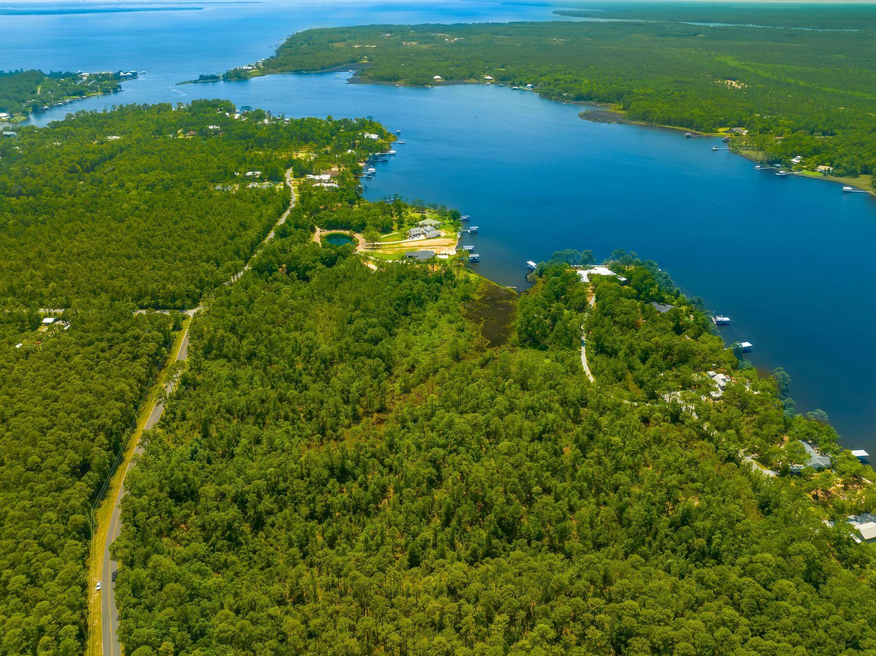 Nestled within the city of Freeport lies a promising 15-acre parcel, brimming with opportunities waiting to be seized. Just a stone's throw away from the shore of Choctawhatchee Bay and surrounded by new developments, this tract of land stands as a beacon for investors or developers. Whether it's a sprawling residential enclave, or an exclusive development the possibilities are as vast. For the individual seeking privacy, it presents a rare opportunity to create a private oasis. Accessible yet secluded, promising yet ripe with potential, this 13-acre parcel in Freeport stands as a testament to the boundless possibilities available for investors, developers, or an end user with dreams of crafting your own slice of paradise, this parcel offers endless opportunities.