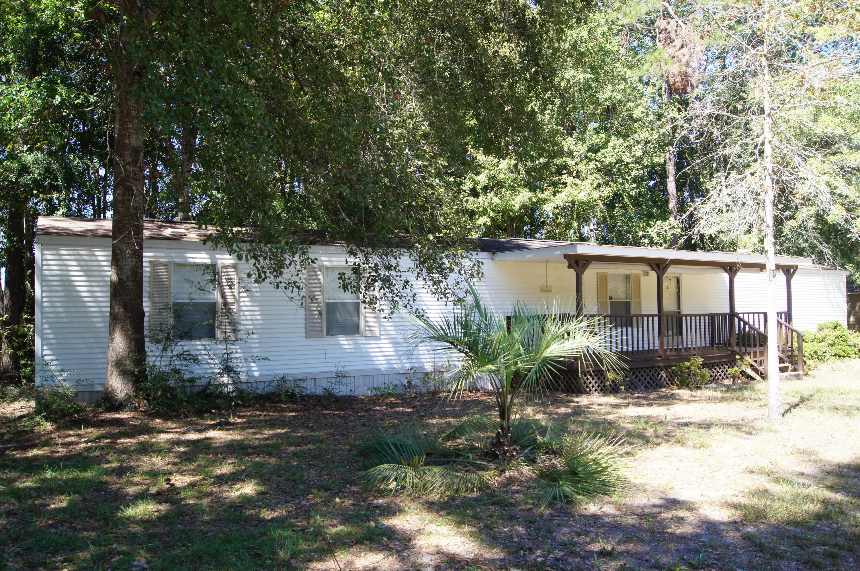 Nice home on large lot being sold mostly furnished including appliances. Nice large front and back porch. Yard building is included. Currently used as a weekend getaway. Perfect for second home, permanent residence, size down home or a starter home. Being sold AS IS. Trundle bed in center bedroom, contents of closets, personal photos, and artwork do not convey.