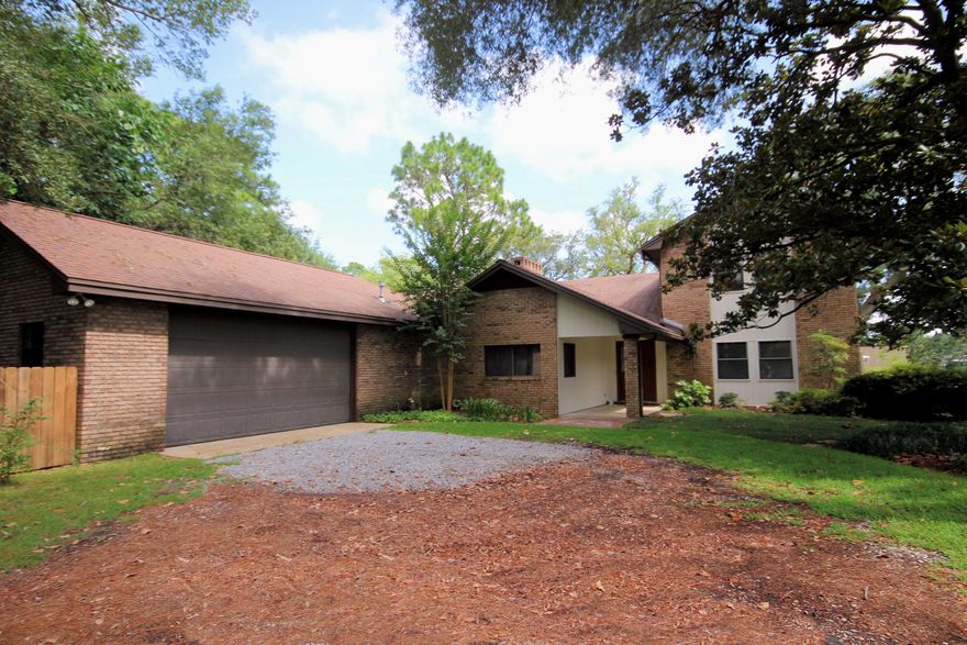 Bayou waterfront home is located on 92 feet water frontage in desirable Poquito Bayou subdivision. Although built in 1956,the home was renovated in 1983. The downstairs living/dining room area is 22' X 36' and features blonde maple flooring and panoramic water views. The dynamic cathedral ceilings are white washed tongue and groove. A focal point is the over-sized gas fireplace with decorative wood and marble mantle and bold mirror mounted above. This open great room leads to the kitchen featuring an island style cook-top with breakfast bar, built-in pantry shelving with spice racks and food storage. The kitchen leads to a hand-scraped wood style flooring family room with built-in windows with deep window sills overlooking a brick patio area with a gas grill and water beyond.