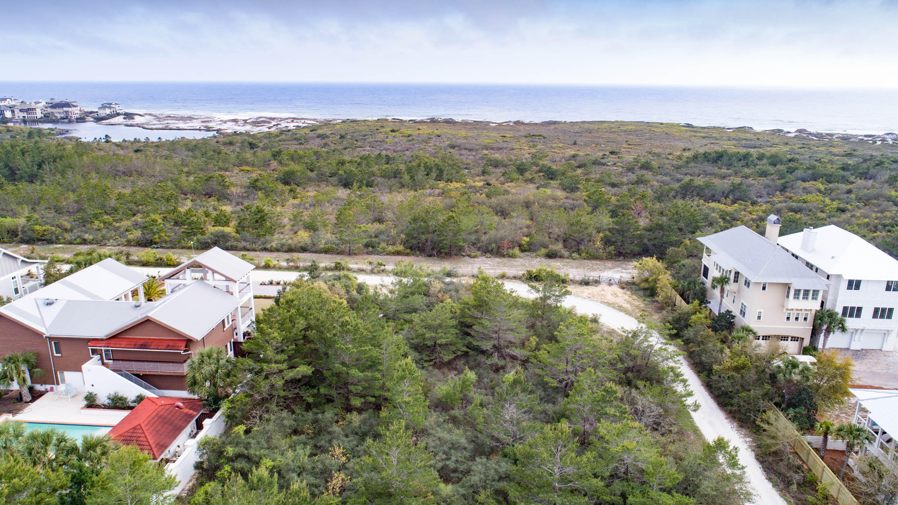 Private, large, corner lot with so many unique features; including a 40 ft elevation and an un-nobstructed view of Topsail State Park and the Gulf of Mexico. Enjoy the abundance of wildlife and build your private estate on the 100' x 140' lot with additional buffers space. Located in a secluded neighborhood on the coveted West end, just off Hwy 30A, close to the water and No HOA. Buyer to verify all information.